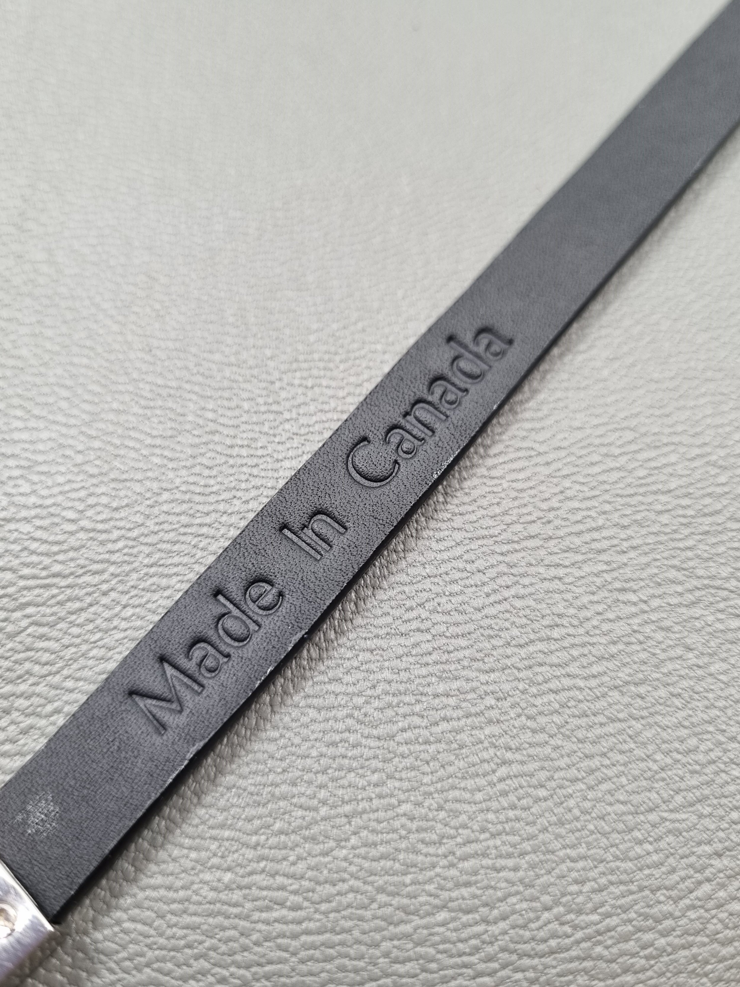 Black python leather bracelet with Made in Canada embossing