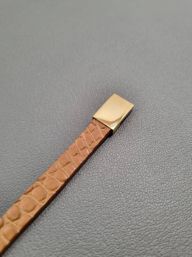 Cognac crocodile leather bracelet with a gold magnetic clasp, made by Pila Luxuria in Canada.