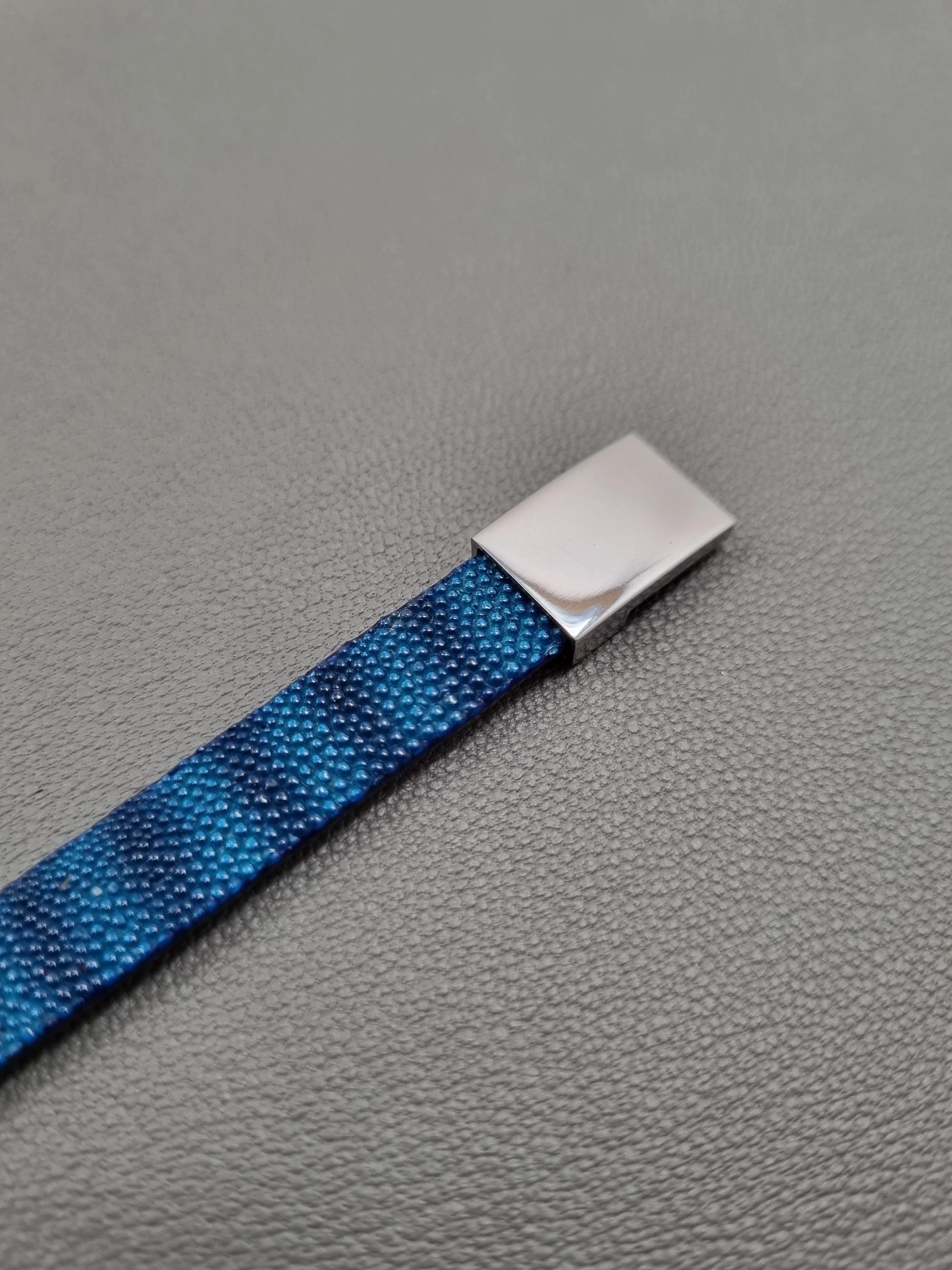 Silver clasp luxury blue stingray bracelet with a magnetic clasp, made by Pila Luxuria in Canada.