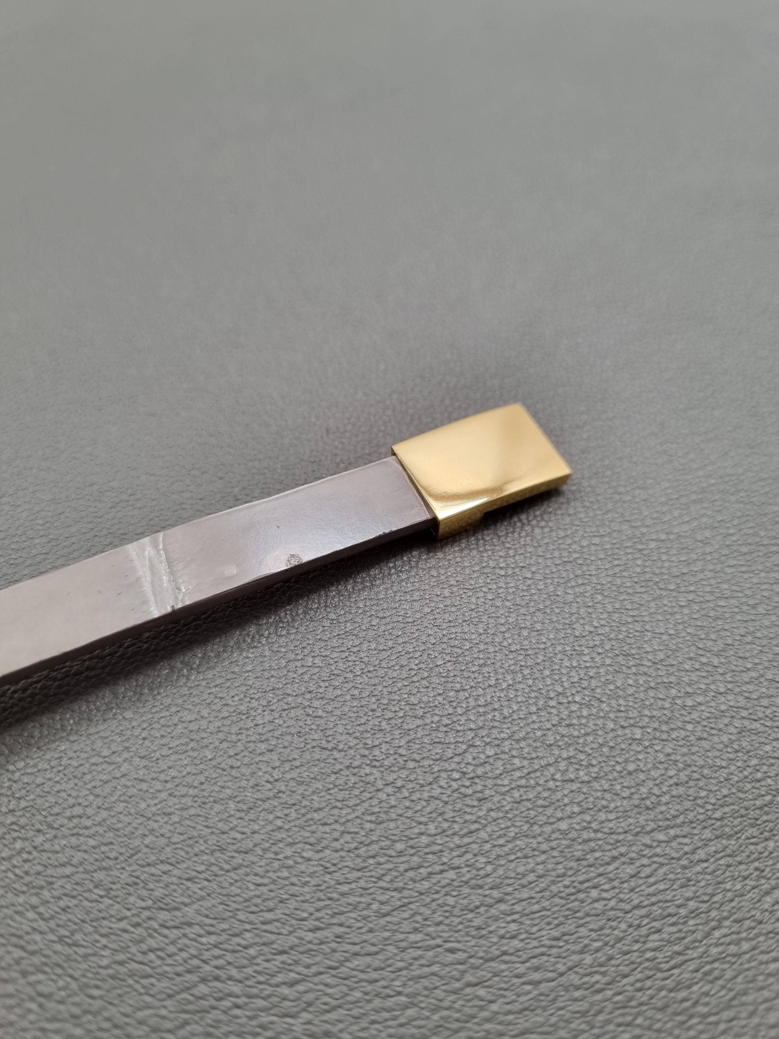Luxury grey crocodile leather bracelet with gold magnet clasp.