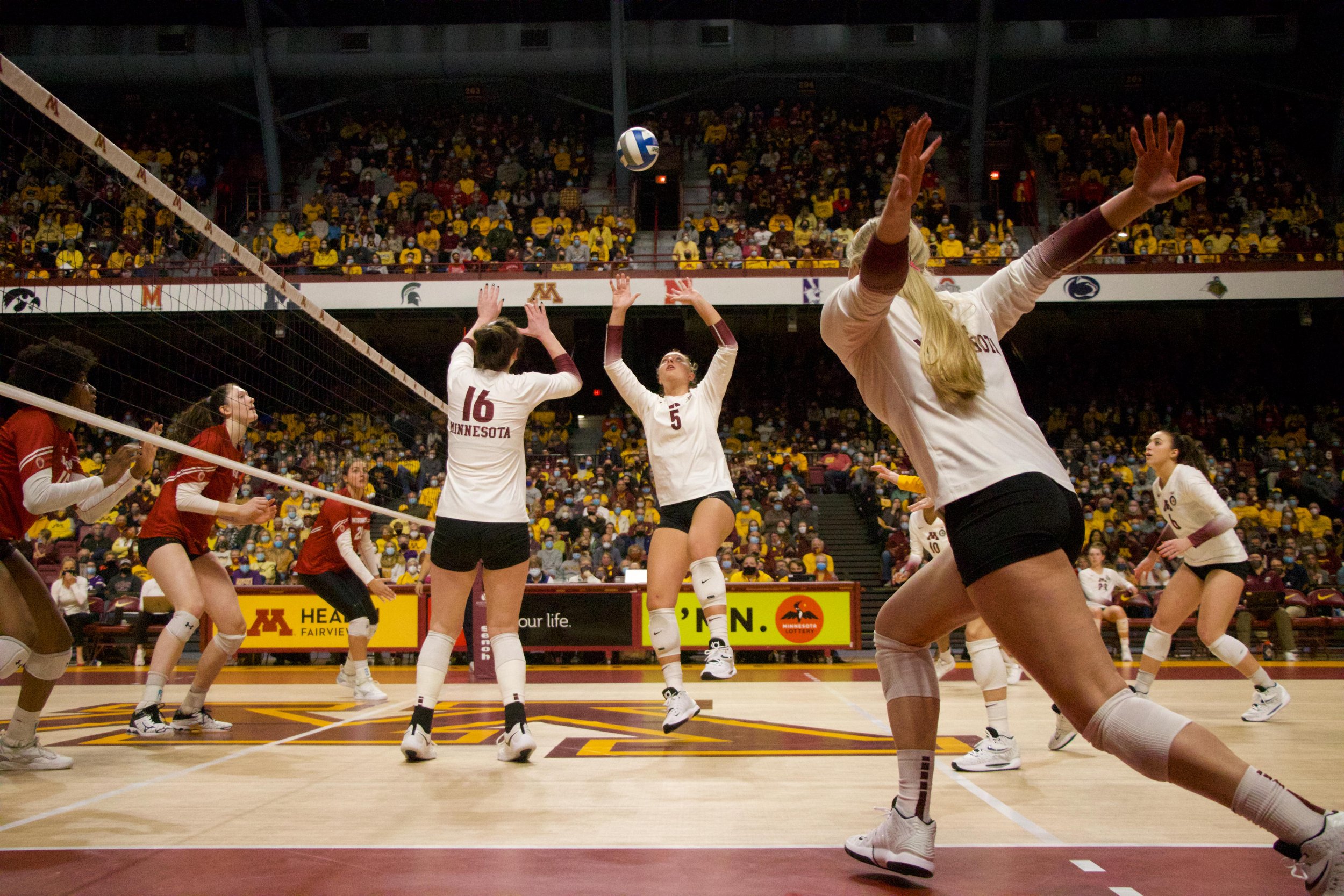 Minnesota Gophers setter Melani Shaffmaster (5) sets the ball to outside hitter Jenna Wenaas (2) in the third set against Wisconsin at Maturi Pavilion in Minneapolis, Minn., on Sunday, Nov. 21, 2021. The Gophers lost to Wisconsin in 5 sets, 26-24, 19