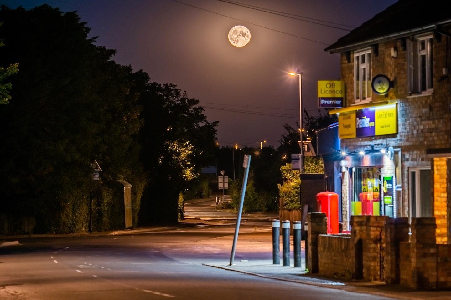 Full moon rising over the street