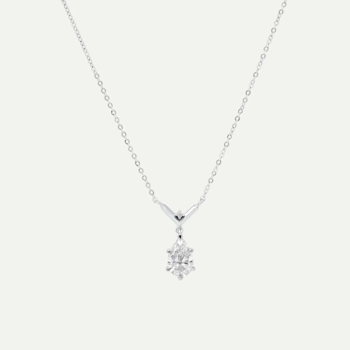 Custom platinum necklace with 6 claw setting pear-cut and round brilliant-cut white diamonds from EDXU bespoke jewellery London