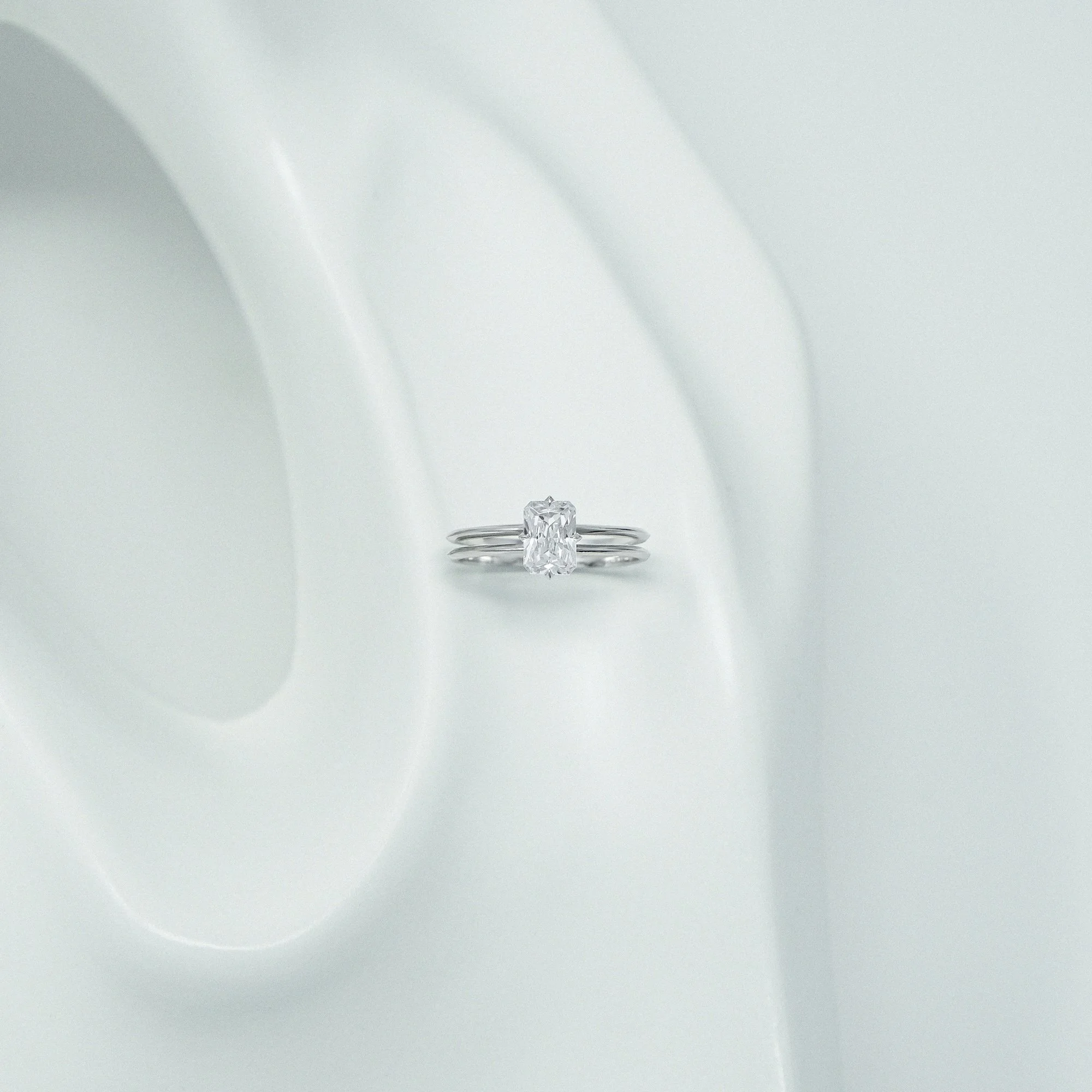 The Xari Ring is a timeless tribute to the Mayan Goddess of Love and Princess of the Forests. Handcrafted in London from recycled 18k gold or platinum, the Xari Ring features a geometric double-band silhouette inspired by the majestic symmetry of May