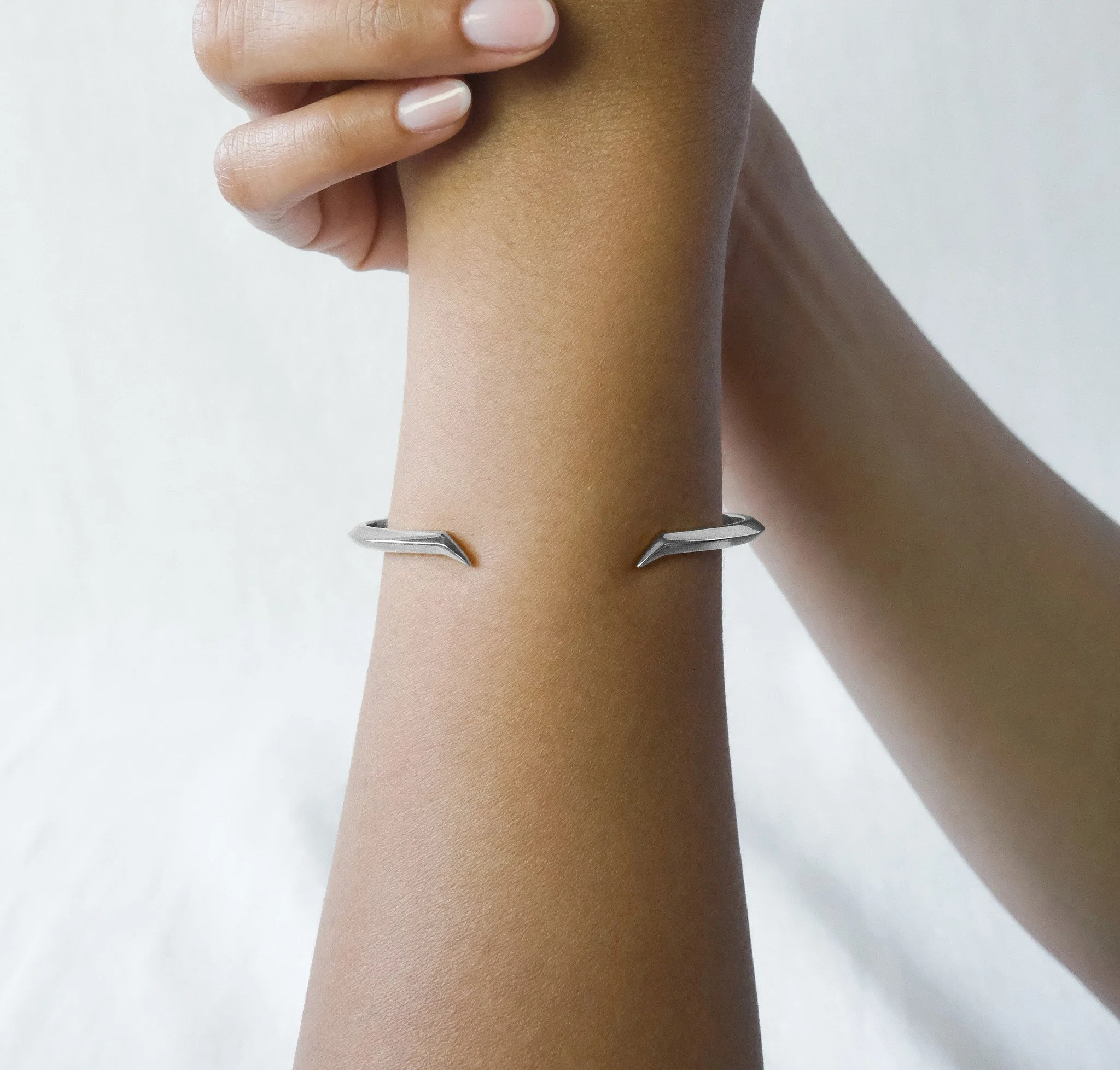 Happy Halloween. Add something sharp to your look this Halloween Eve with our Fang Bangle. Inspired by Antarctica&rsquo;s sculptural landscapes and the flowing elegance of calligraphy, it combines architectural form with refined precision. Bare, mini