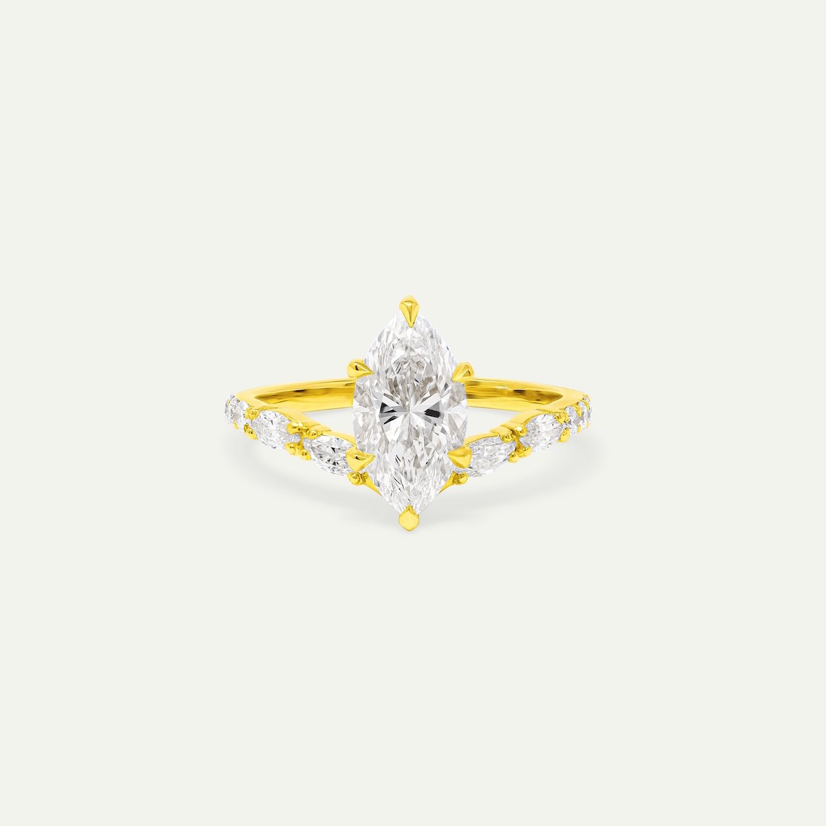 Venos modern engagement ring in 18ct yellow gold with marquise and round brilliant-cut white diamonds from EDXU bespoke jeweller London