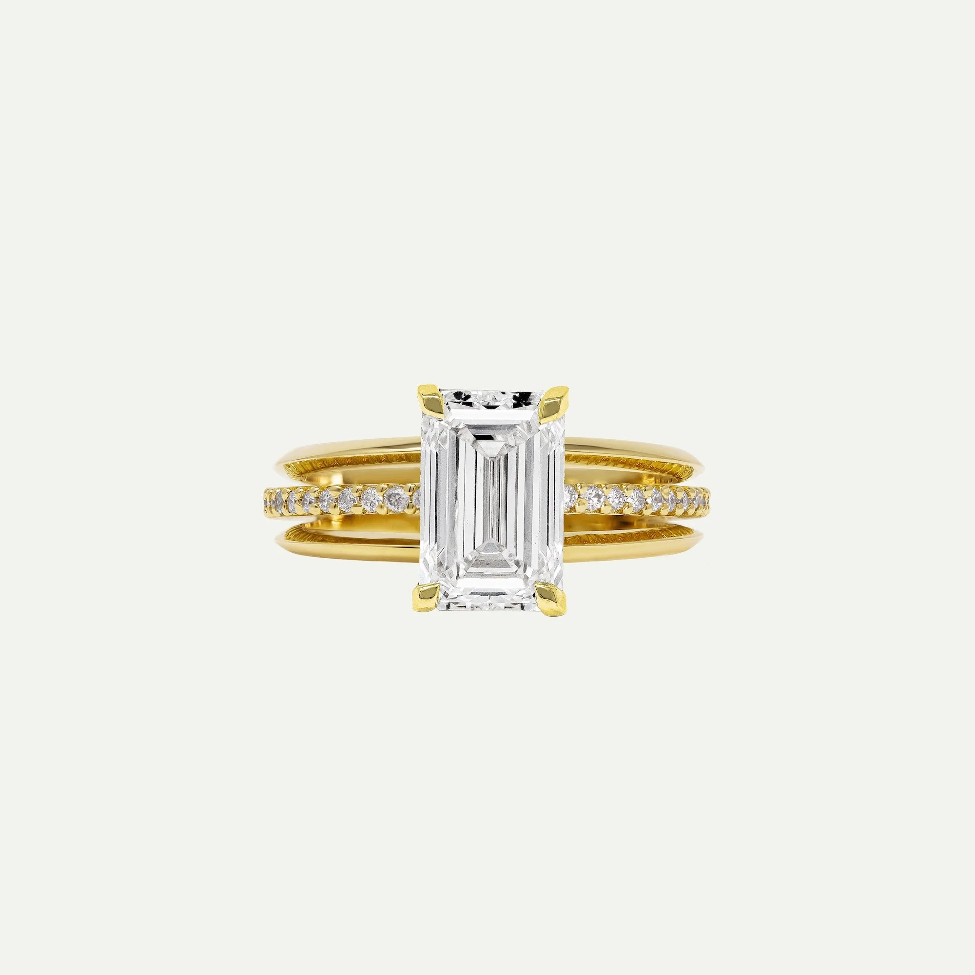 Maeve modern alternative engagement ring features a centre emerald-cut diamond with architectural 3-band design with small diamond pave on white background from EDXU bespoke jeweller London