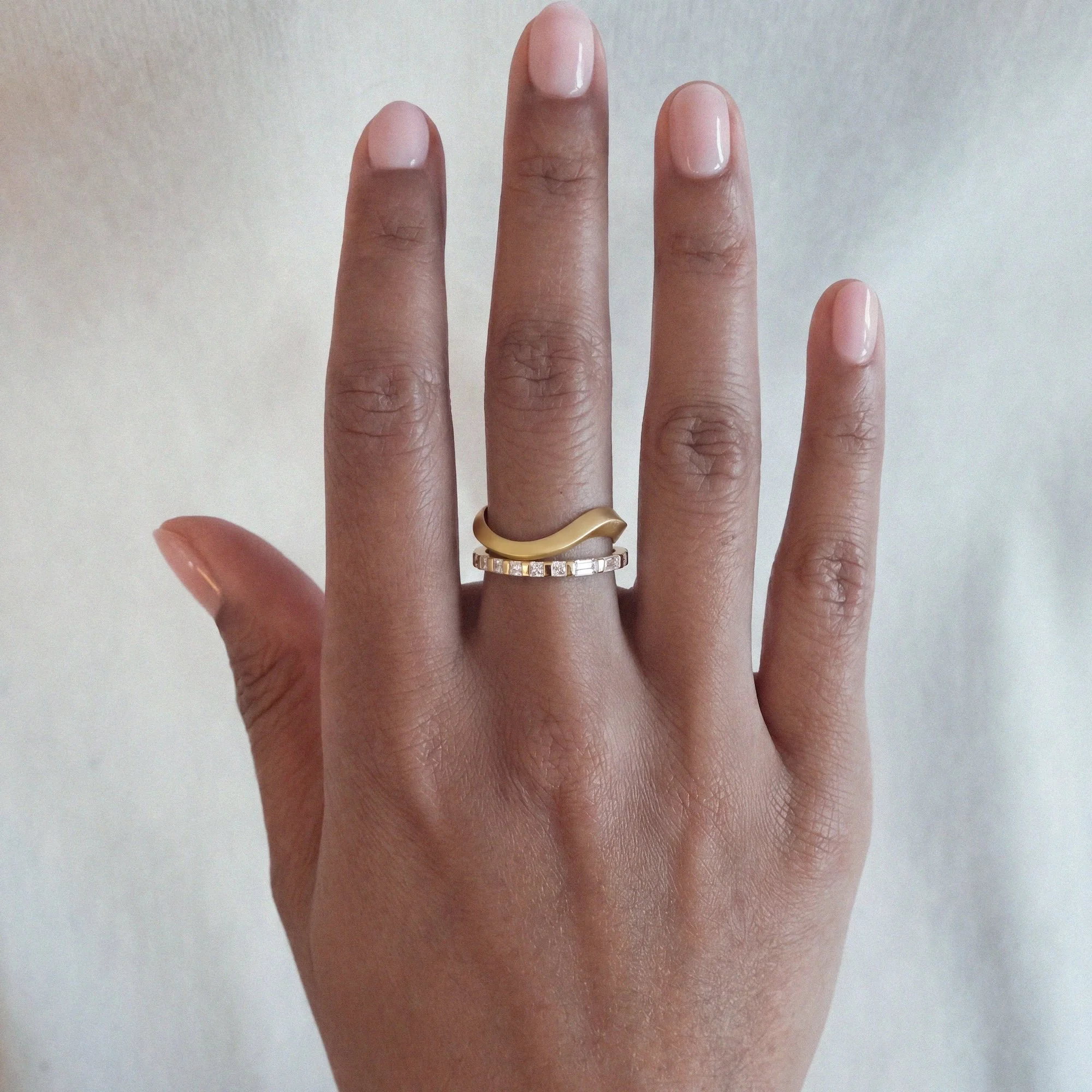 alternative architectural diamond engagement ring in yellow gold with princess and baguette white diamonds in morse code from EDXU bespoke jeweller London on a model hand