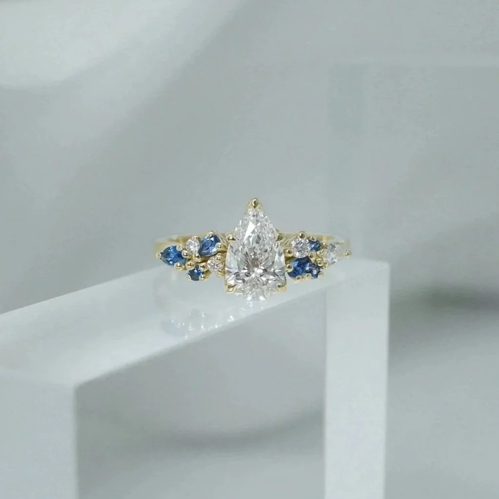 EDXU London bespoke Bendio engagement wedding rings in 18k yellow gold with emerald-cut yellow sapphire and white diamonds pave 