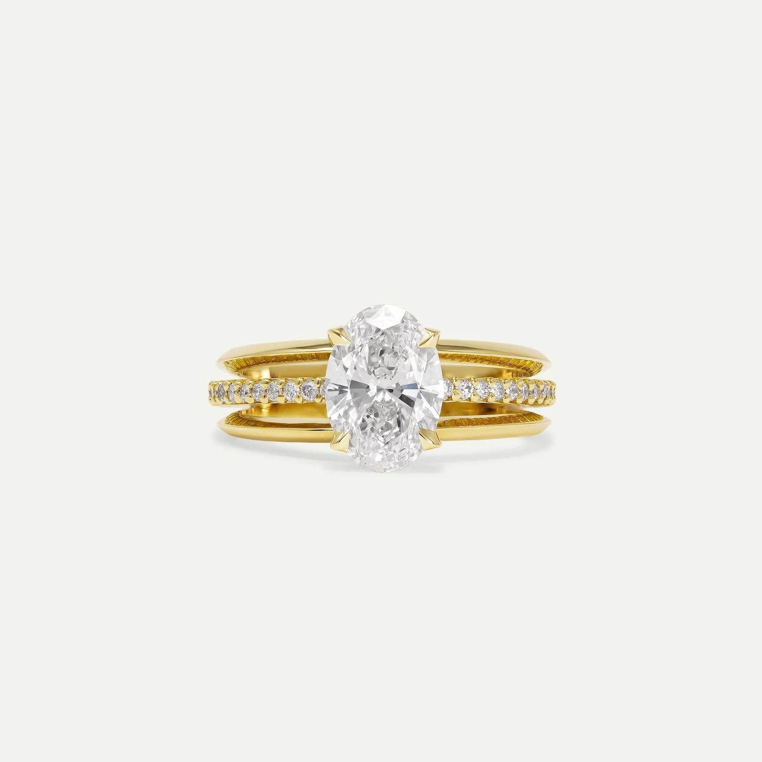 bespoke modern diamond engagement ring in 18ct yellow gold with oval diamond and melee pave diamonds from EDXU bespoke jeweller London