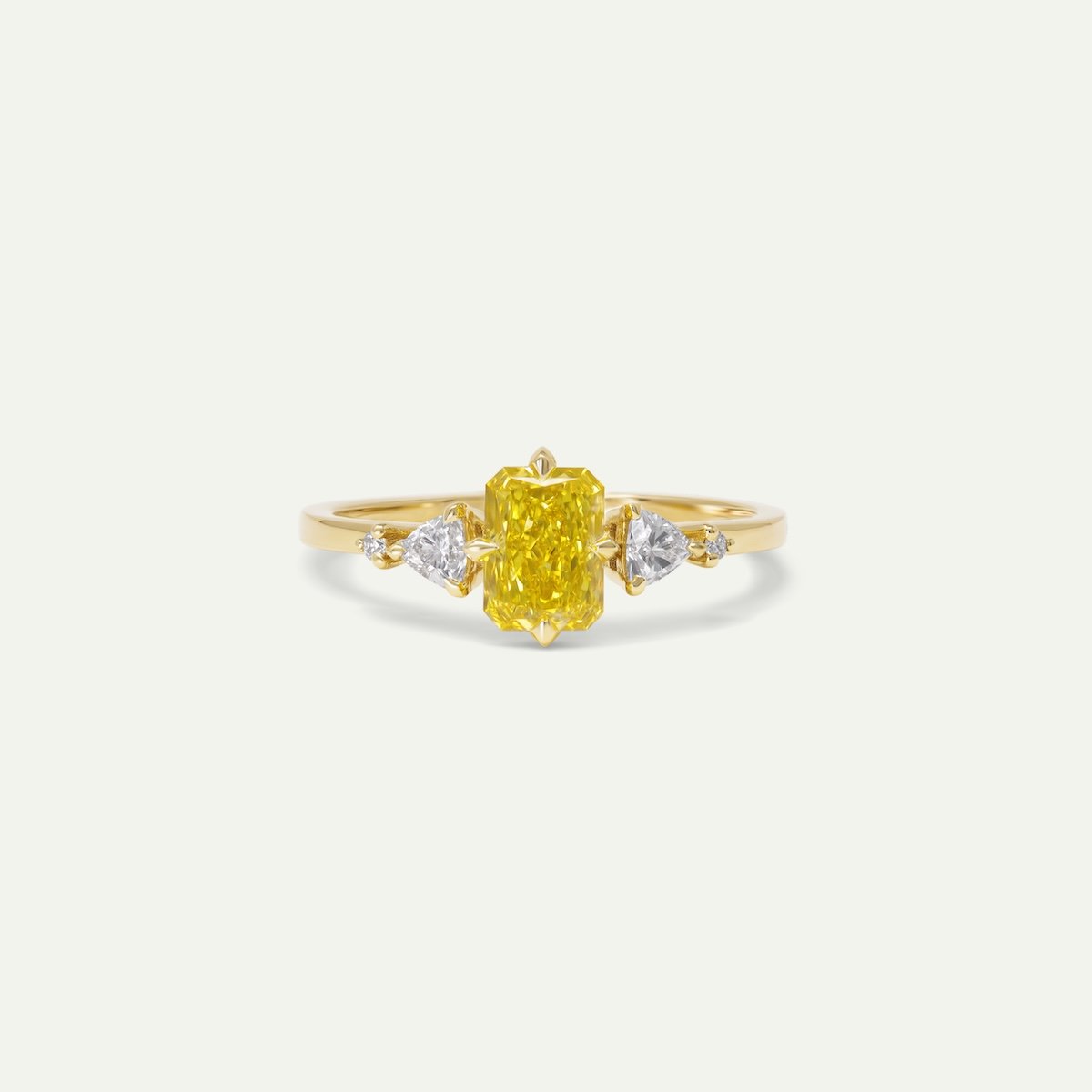 Bespoke jewellery Amara ring in 18ct yellow gold engagement ring with radiant-cut yellow diamond shouldered with trillian and round brilliant-cut white diamonds from EDXU London custom engagement ring
