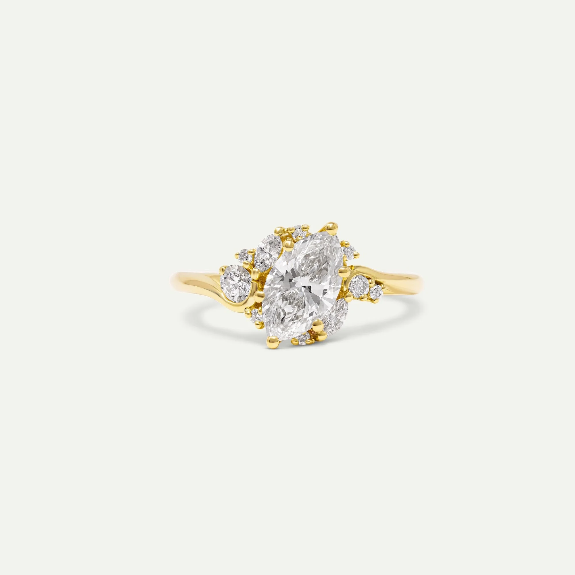 Comieke ring in 18ct yellow gold engagement ring with marquise-cut centre diamond and various sizes melee diamonds side stones from EDXU London bespoke