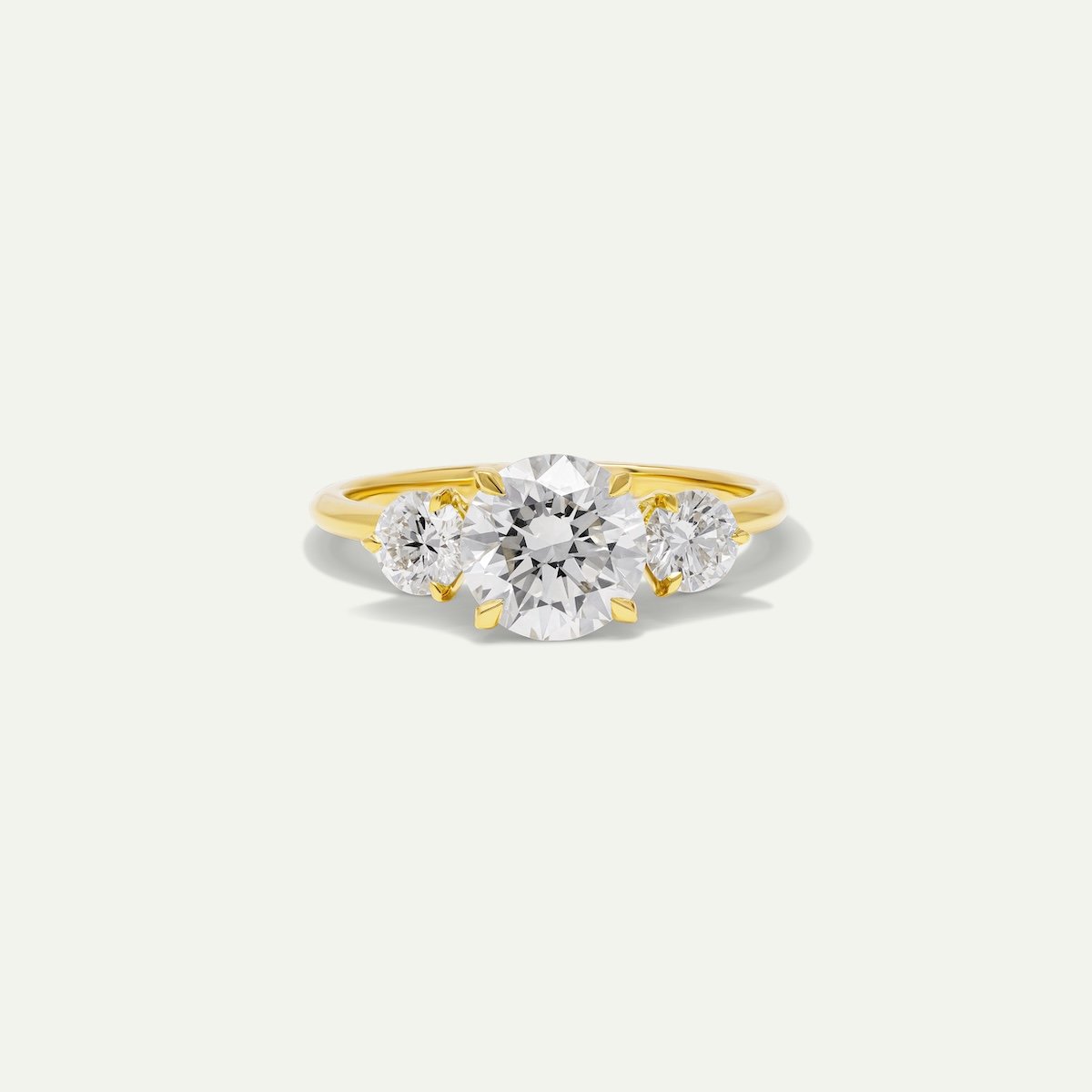 Bespoke engagement ring in 18ct yellow gold 1.50ct round brilliant-cut white diamonds with two 0.25ct diamonds on the side from EDXU Bespoke jeweller London