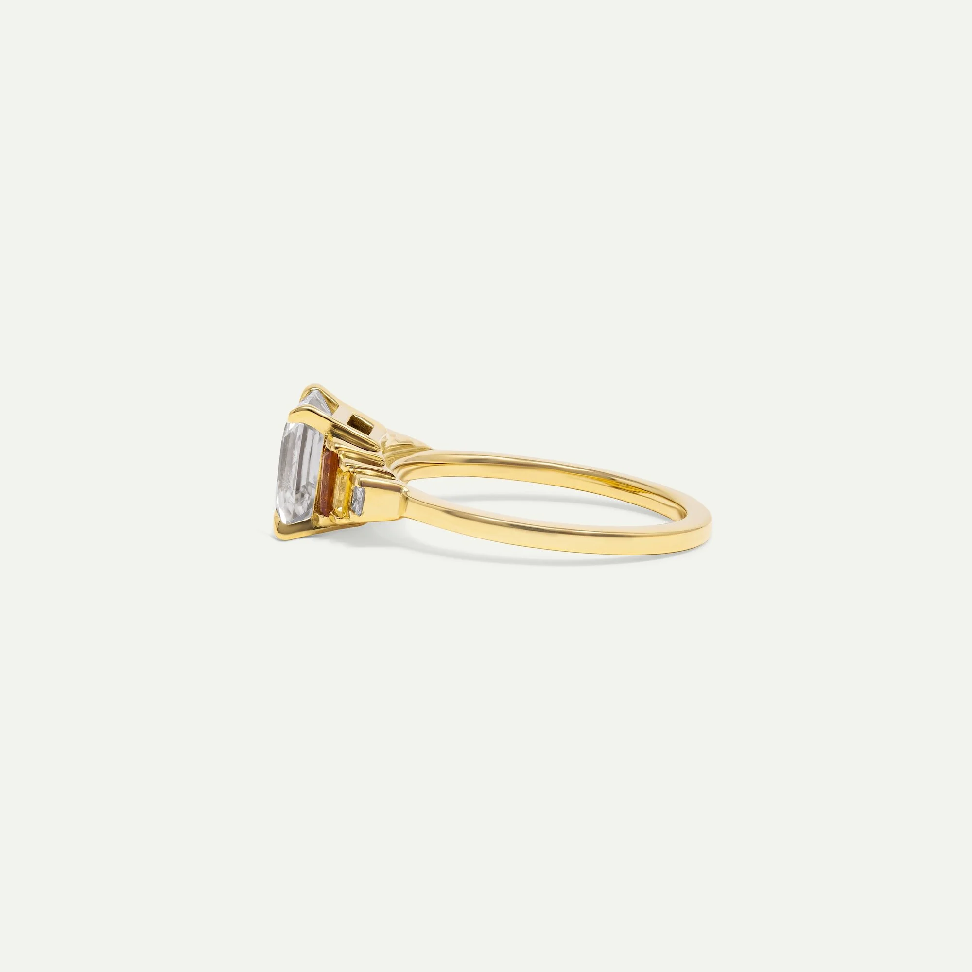 aureon-artdeco-engagement-ring-emeraldcut-diamond-sapphire-gold-edxu-bespoke-jeweller-london-side.jpg
