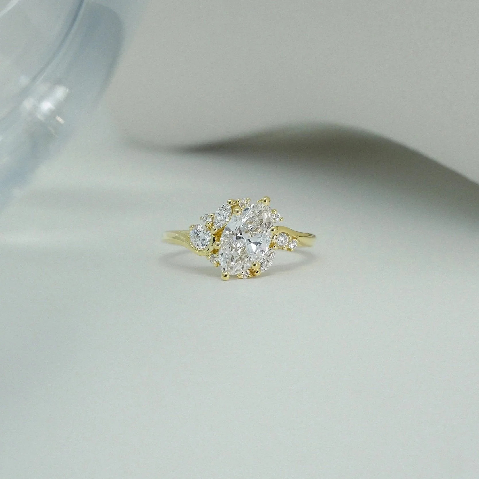 Cosmieke Ring in 14ct yellow gold with marquise-cut white diamonds and various shapes side diamonds engagement ring from EDXU London