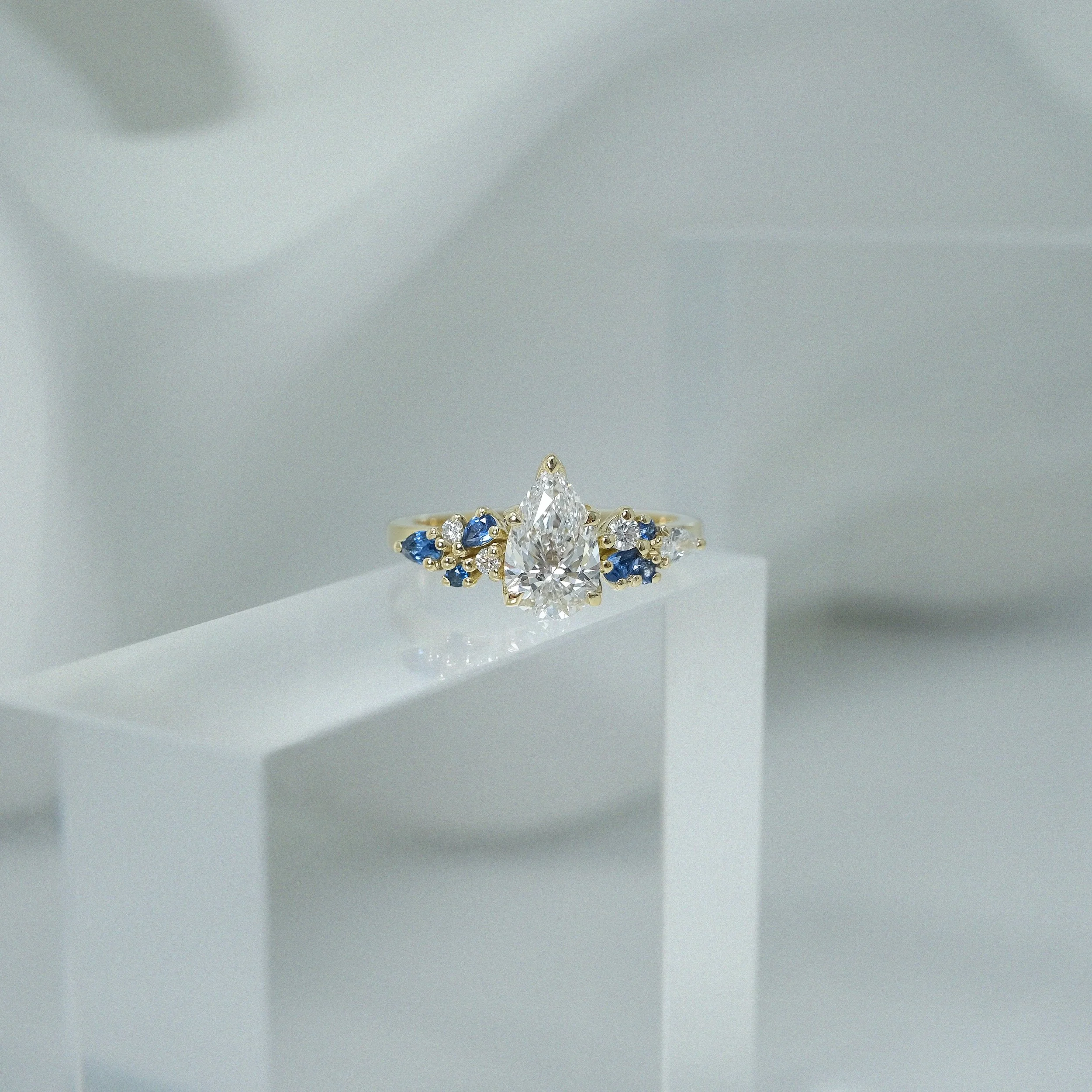 ilias-ring-gold-pear-diamond-sapphire-edxulondon-bespoke-lifestyle-crop copy.jpg