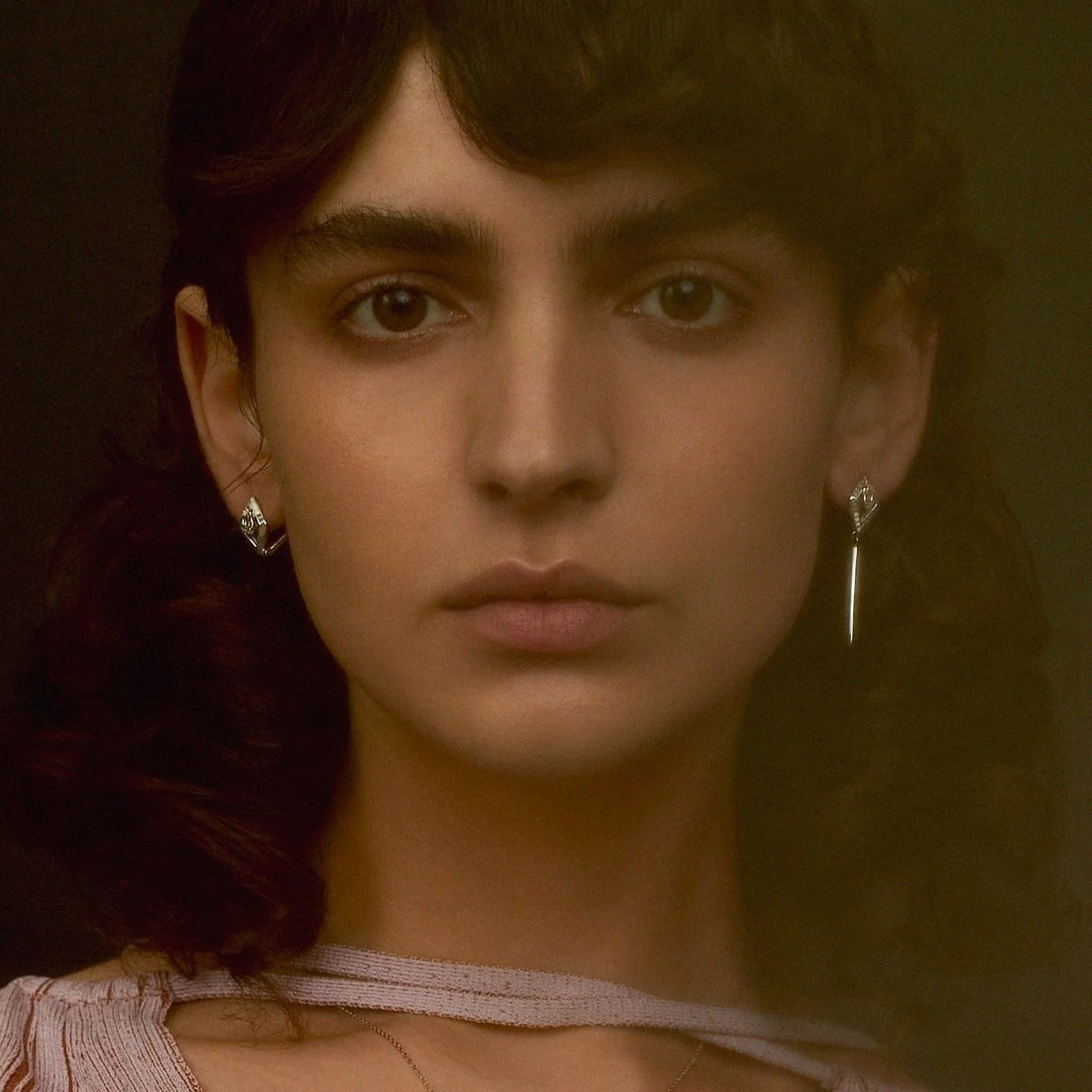 EDXU campaign with model wearing rhodium plated silver Hayden and Kora Earrings with hand-painted enamel and marquise-cut white topaz