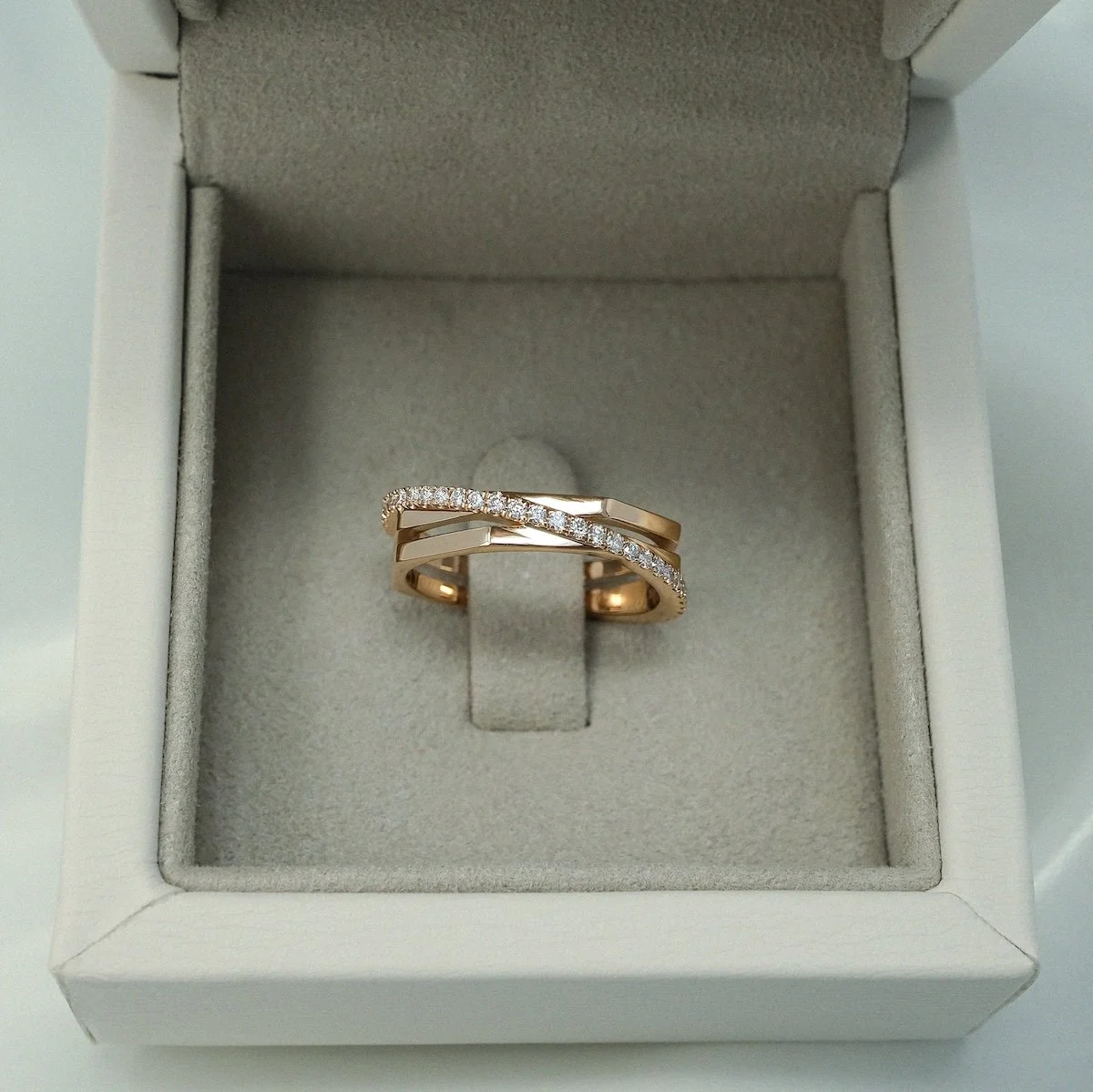 alternative bridal engagement ring Halo in 18ct rose gold with round brilliant-cut white diamonds from EDXU bespoke jewellery London