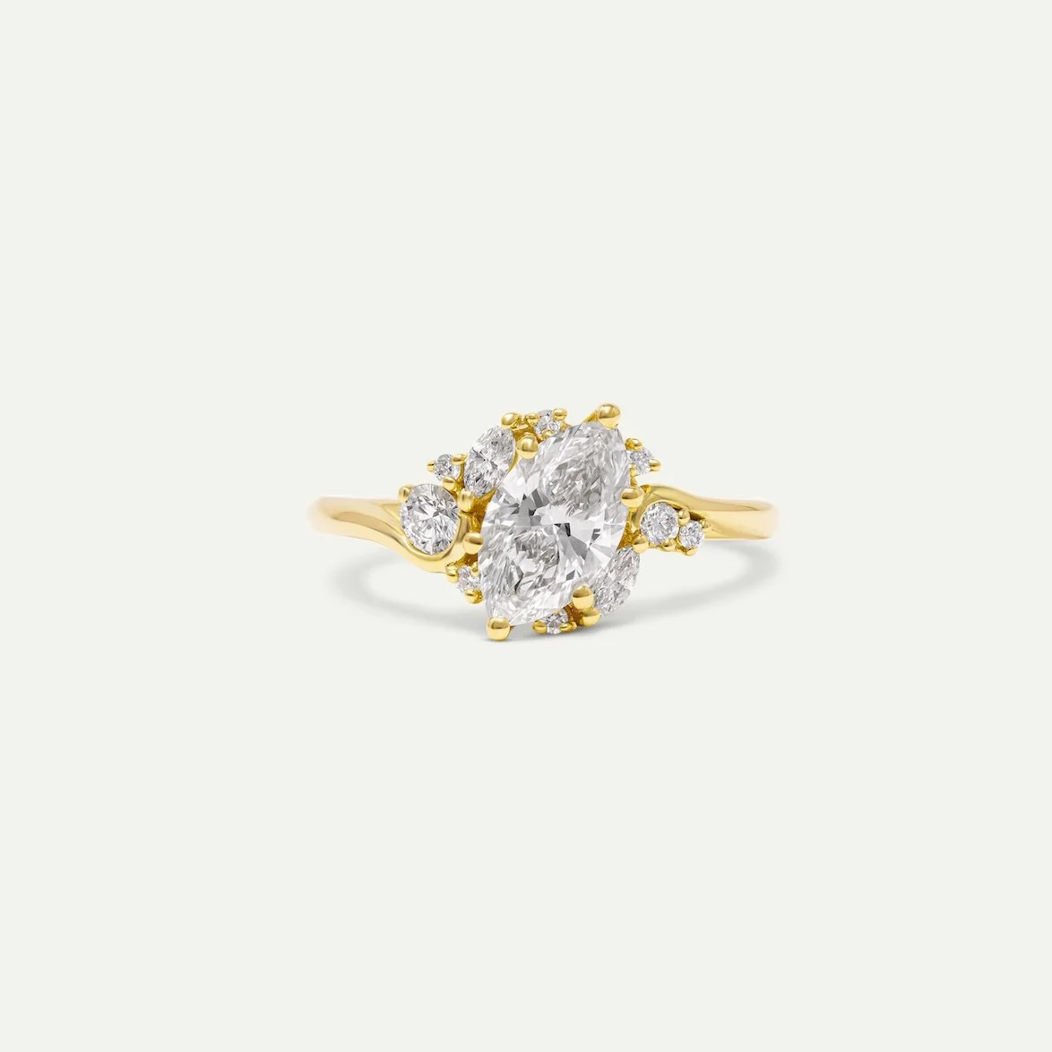 bespoke engagement ring - comieke ring in 18ct yellow gold engagement ring with marquise-cut centre diamond and various sizes melee diamonds side stones from EDXU bespoke jeweller London
