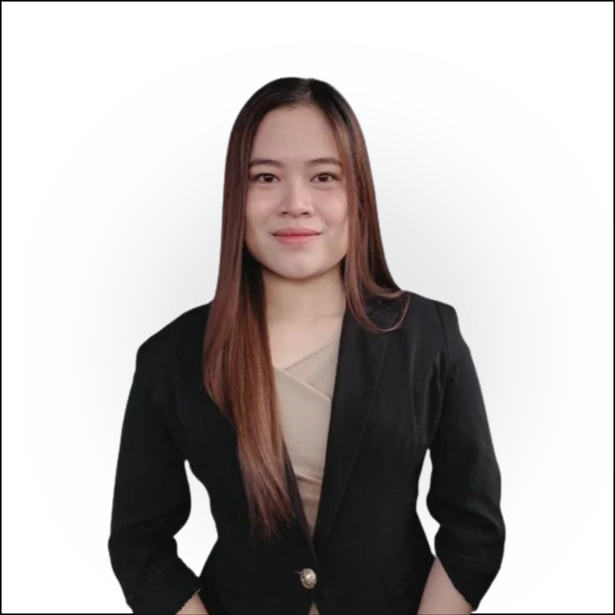 A young woman with long brown hair wearing a black blazer and a beige top, standing against a plain white background.