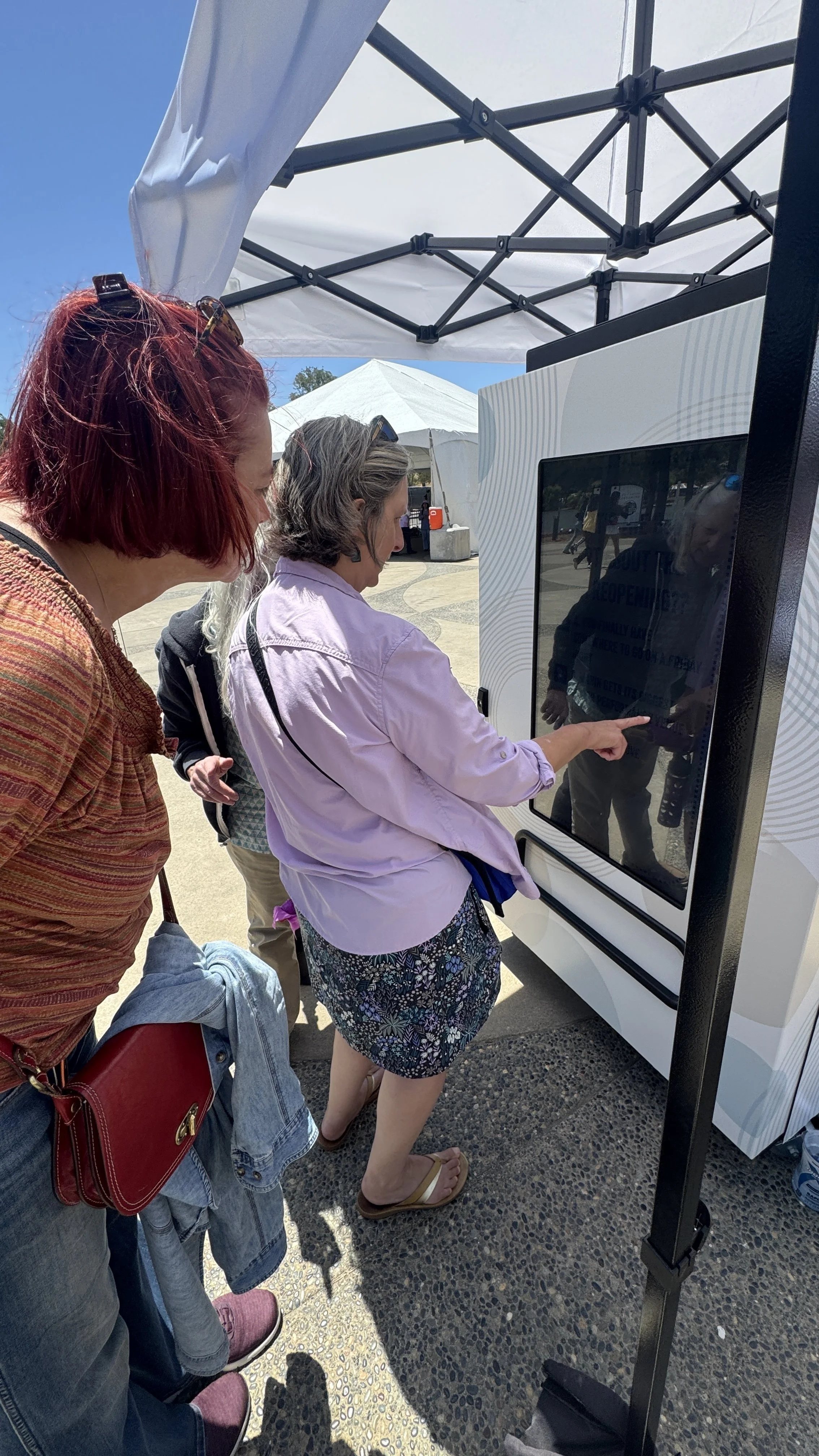 People using Butler, Shine Stern & Partners social media vending machine