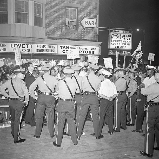 Police attempt to keep members of the Mississippi Freedom Democratic Party from entering the Democratic National Convention. 