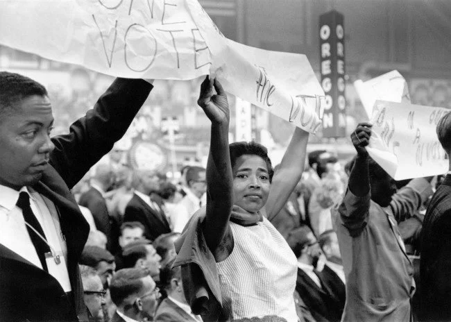 Victoria Gray holds up a MFDP sign at the 1964 Democratic National Convention. 