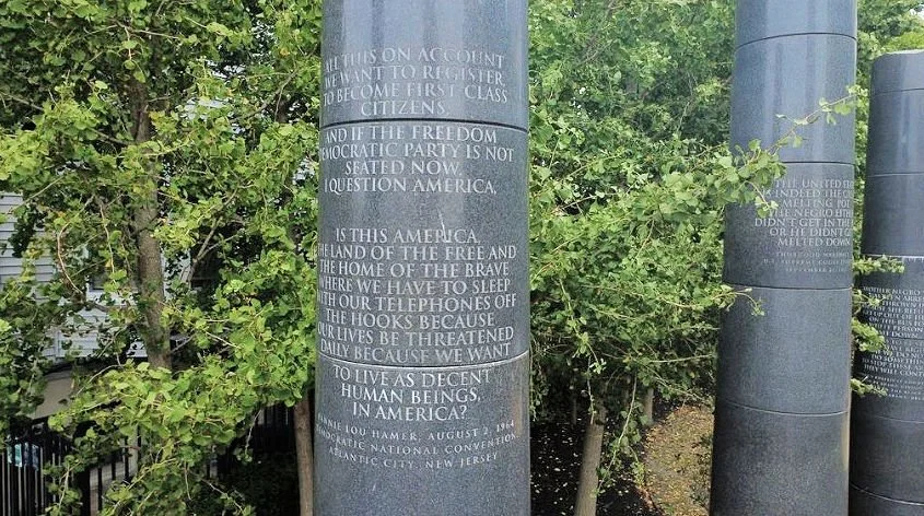 A column bearing a quote from Fannie Lou Hamer's testimony at the Democratic National Convention at the Civil Rights Memorial Garden.