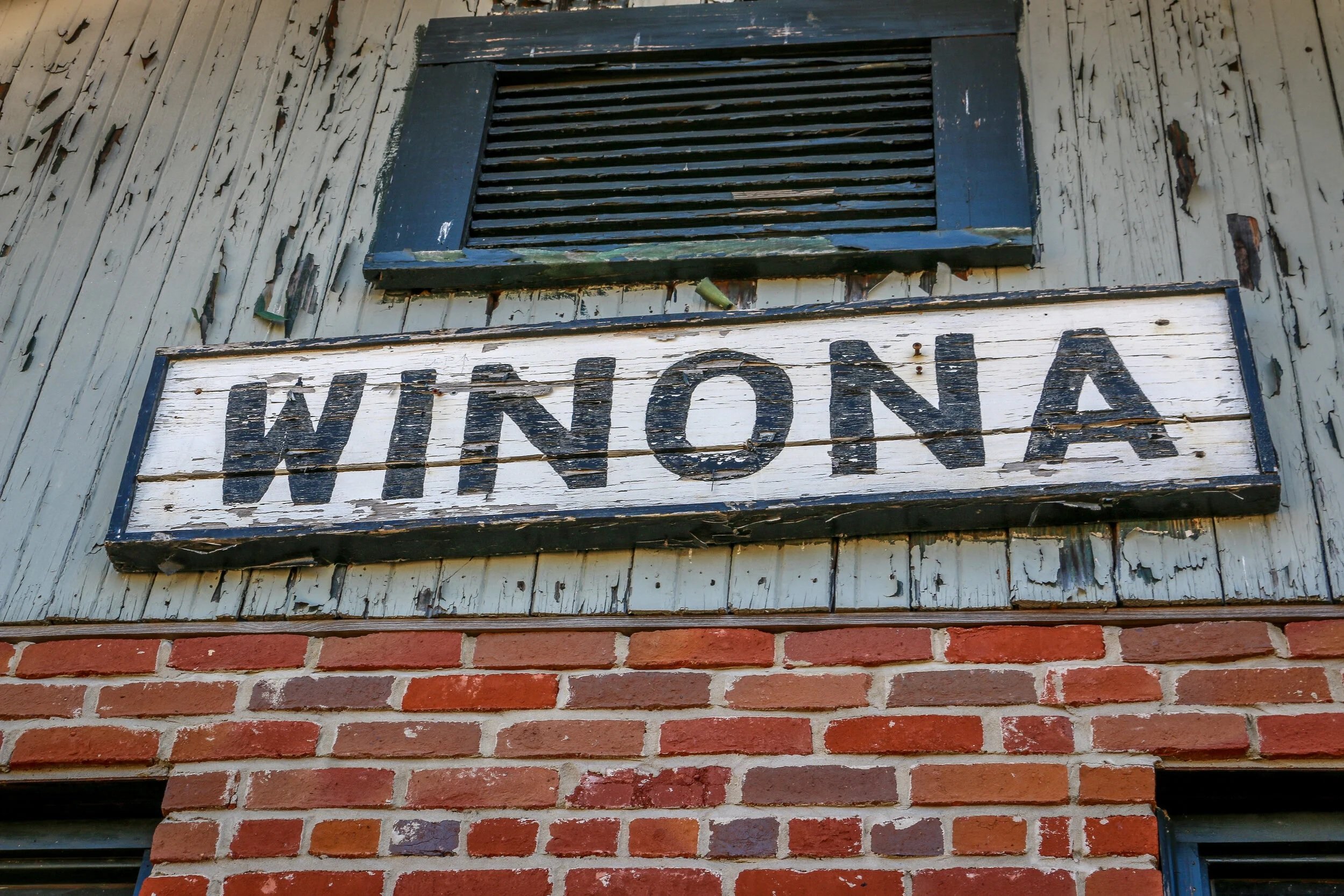 The city of Winona sign at what used to be the train station/depot.