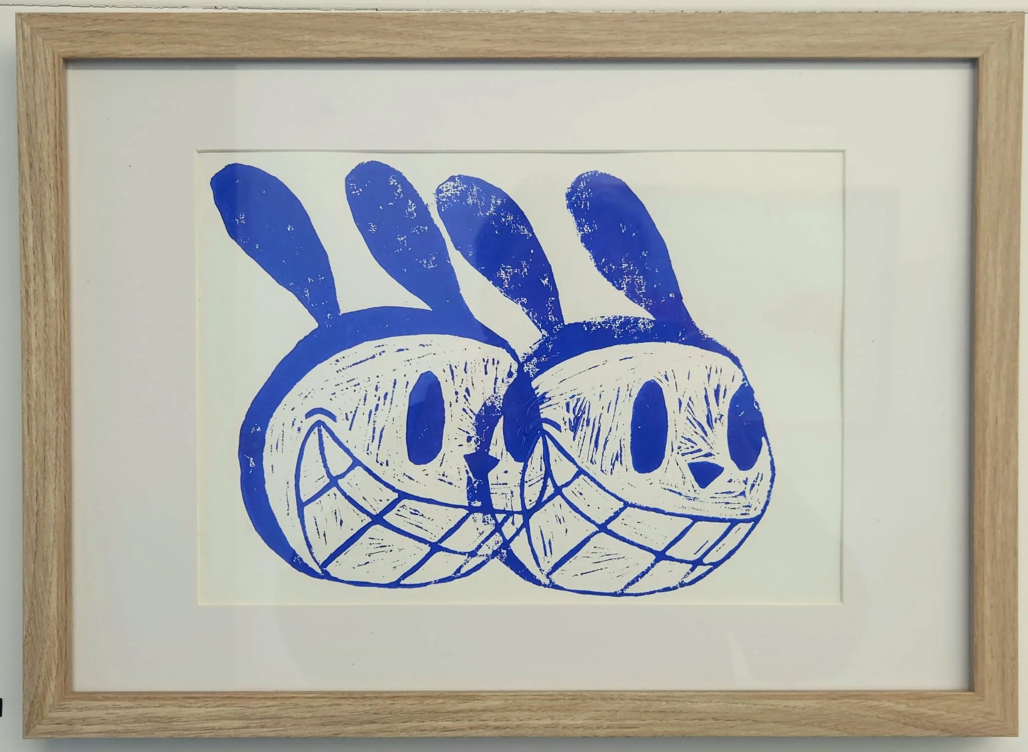 Framed Two blue buunys lino print