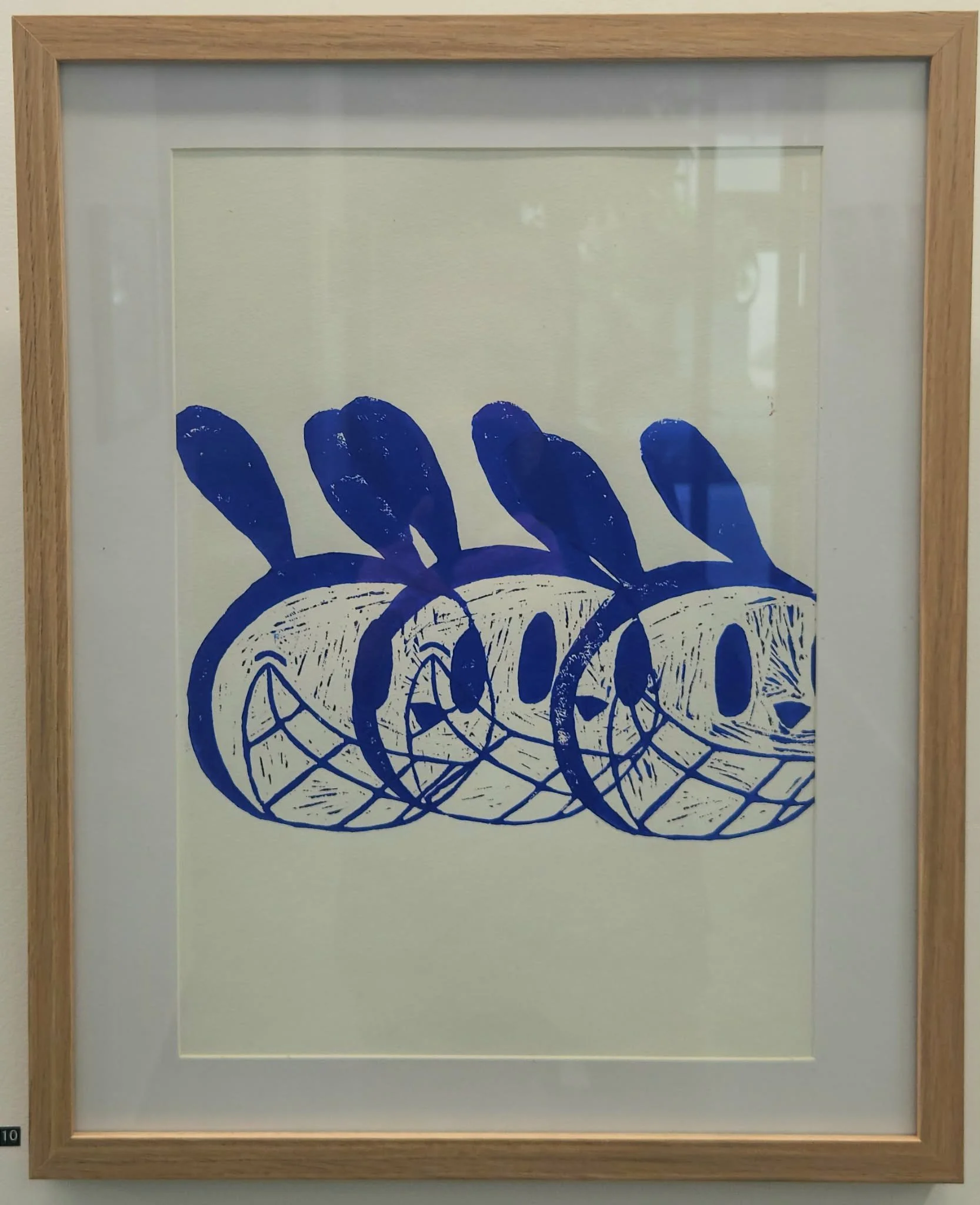 Framedthree blue bunny lino print