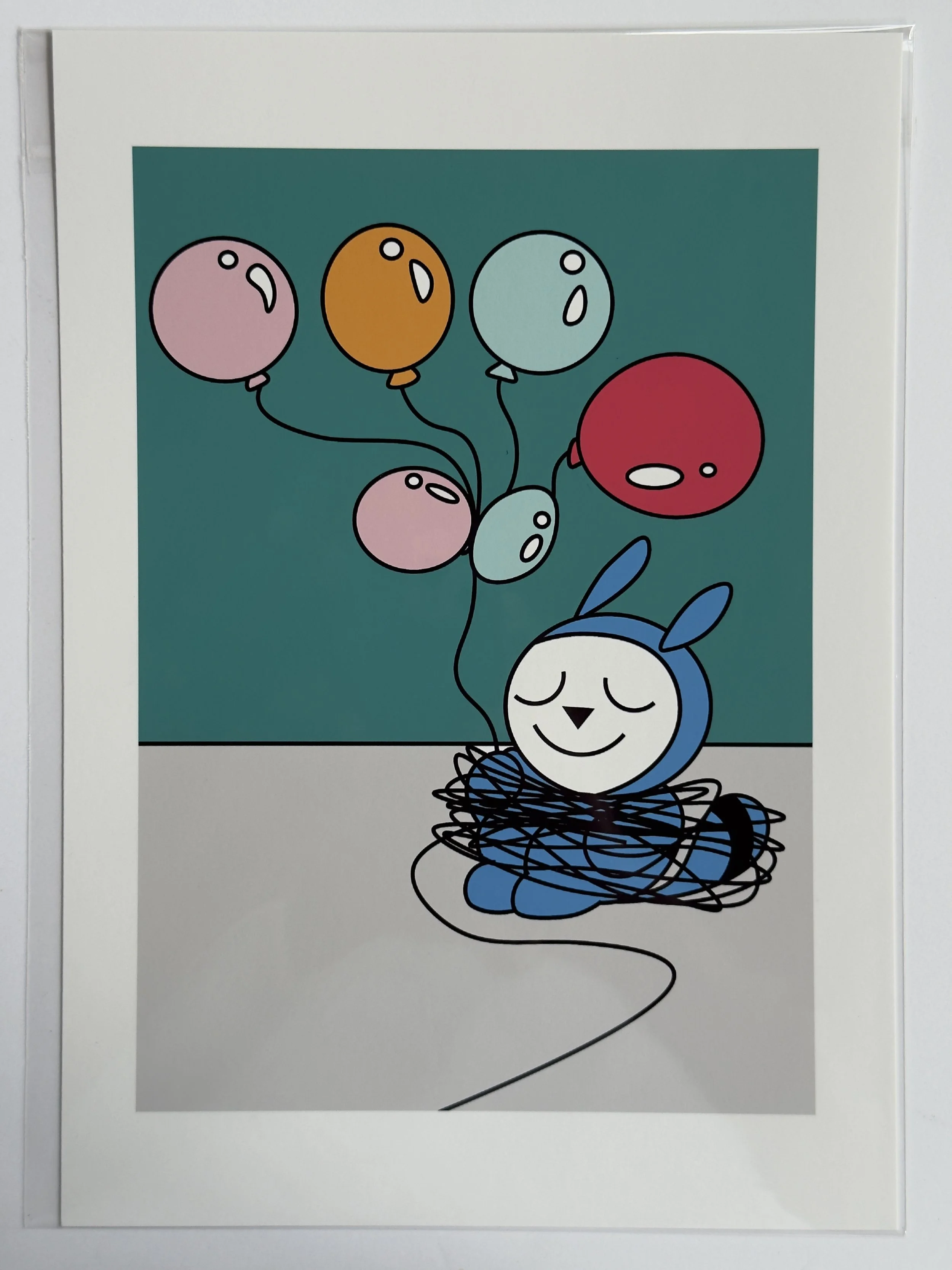 Blue bunny tangled in balloons