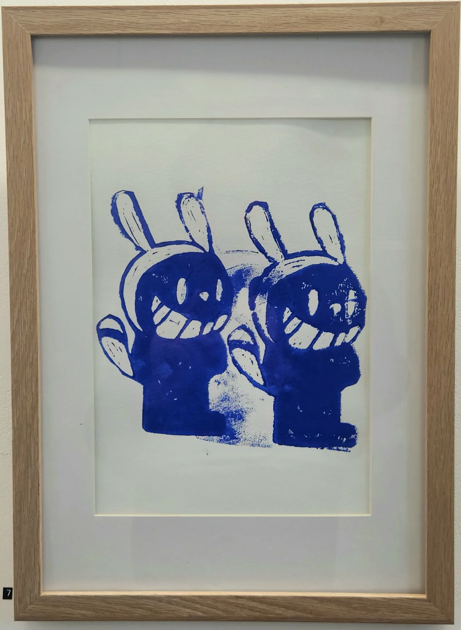 Framed smear blue bunny lino print