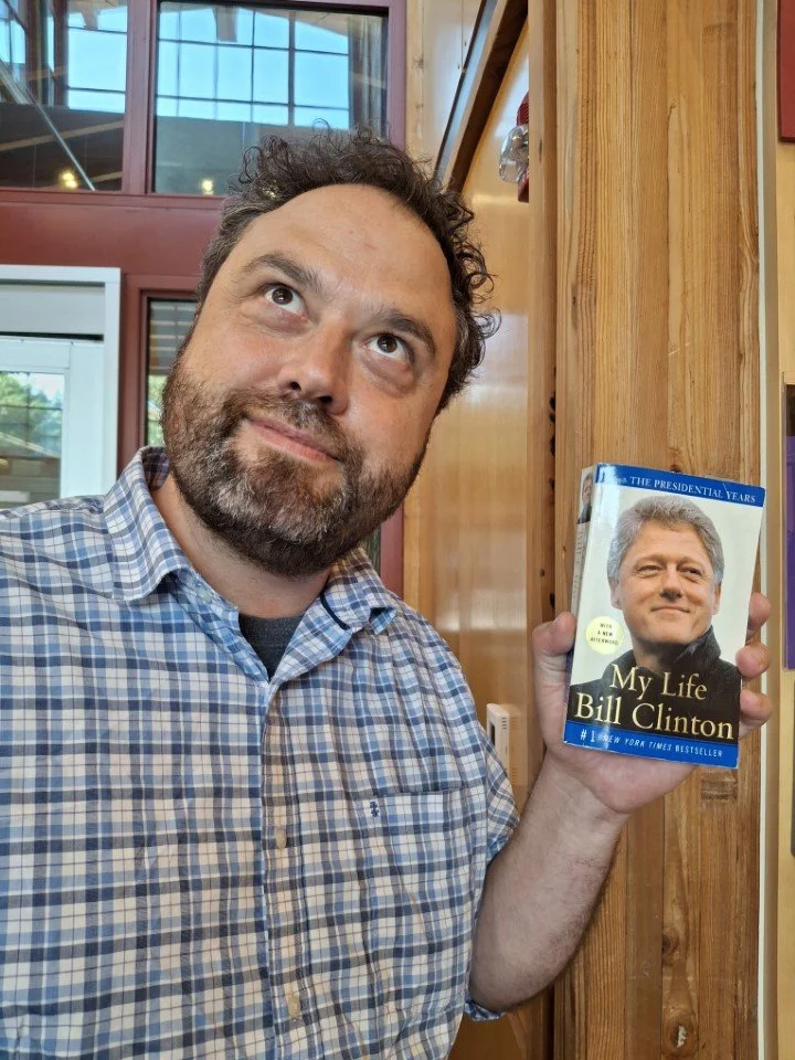 Jamie holds "My Life Bill Clinton" book