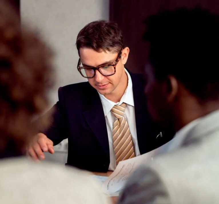 Lawyer and client discussing mediation for a contested estate claim