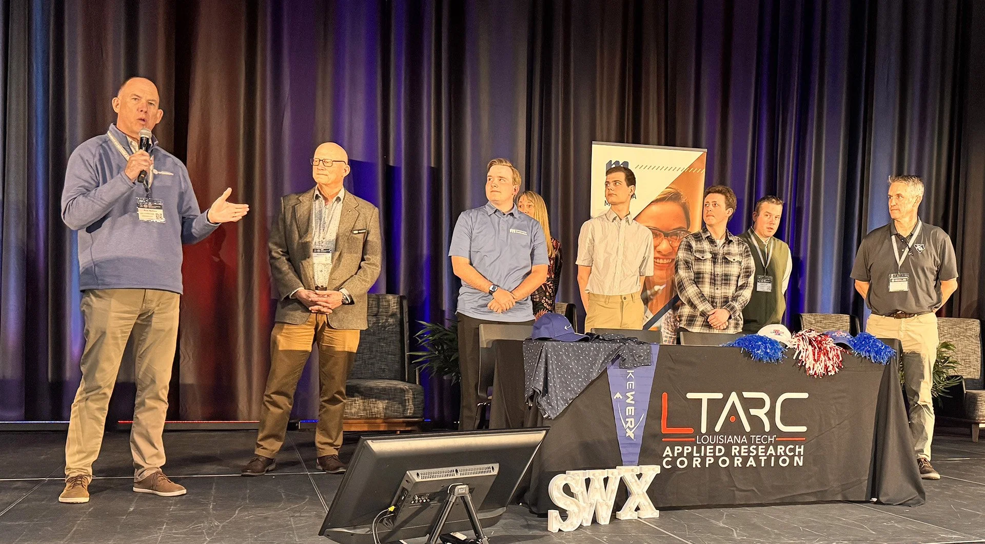 STRIKEWERX Director speaks at ceremony for Fellows
