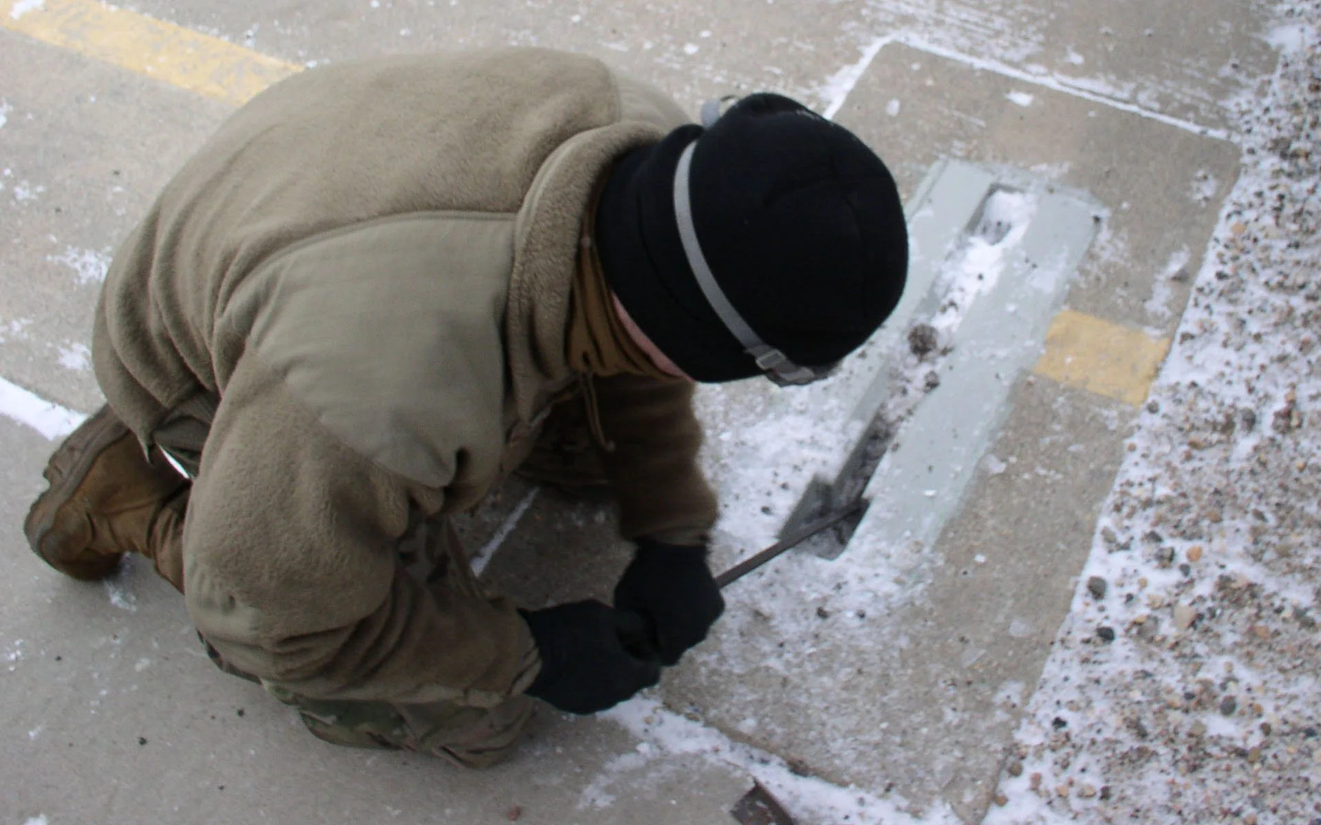 Airman tests defense tech jack stand slot cover in winter