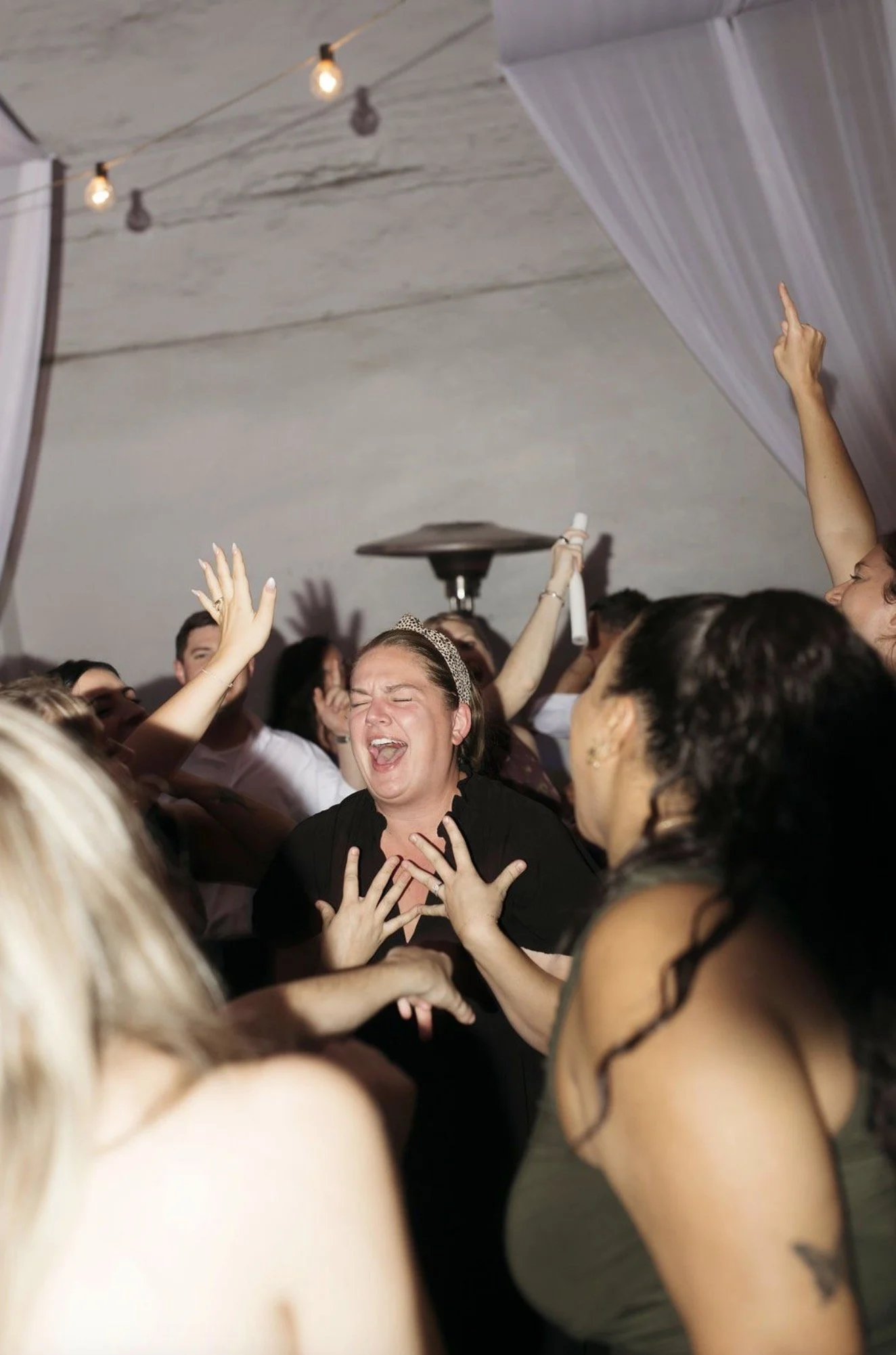 Guests singing along to wedding music at The Atrium.jpg