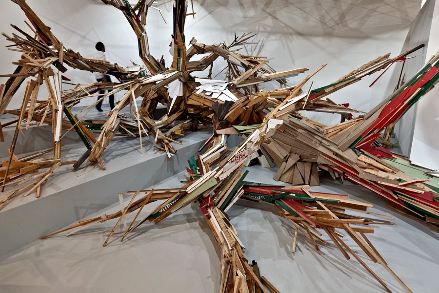 Upgrading by Folke Köbberling & Martin Kaltwasser, 2012. A sculpture of a tree made from recycled materials, which asks how much real timber is used in today's wood products.