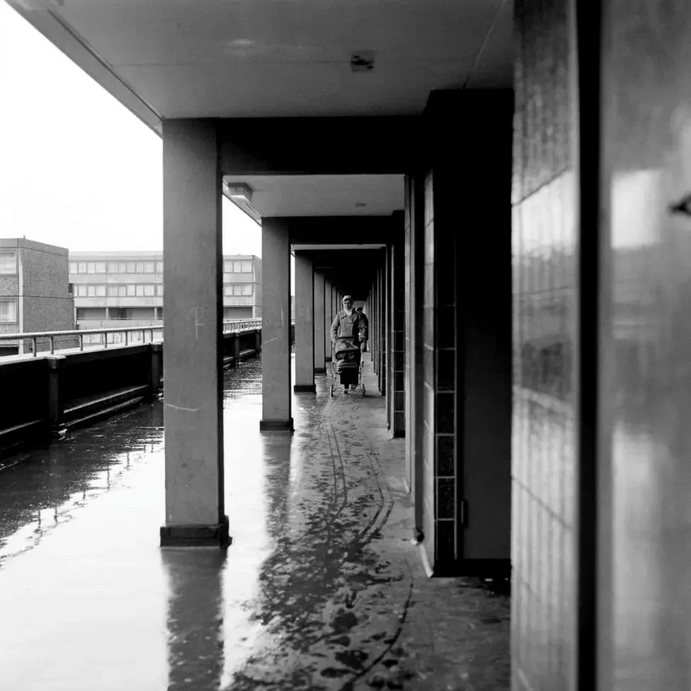 Woman pushing a pram in 1979 along one of the 21km of walkways that made up and connected the blocks.