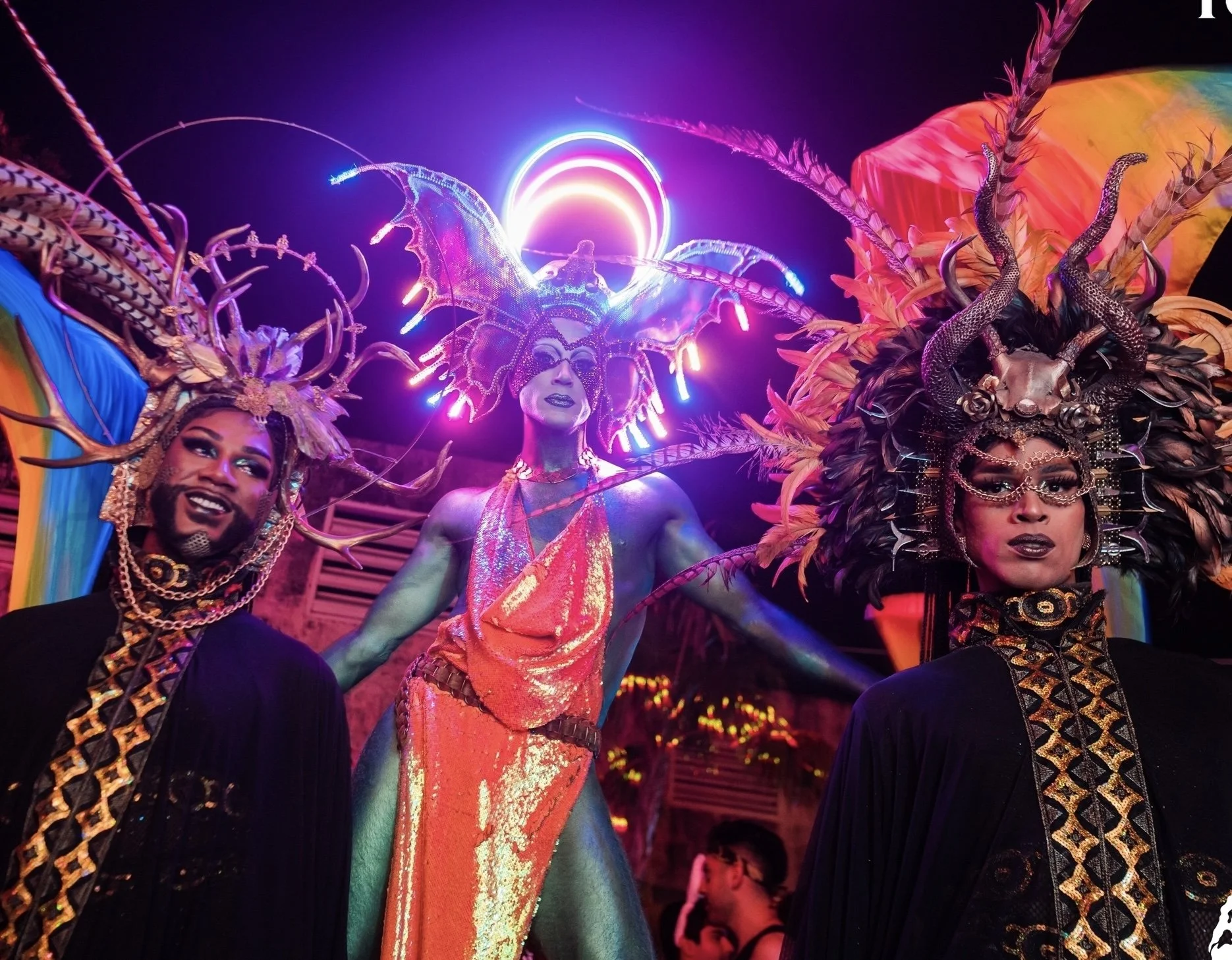 Darrell and two performers wearing elaborate costumes and custom headresses.jpg