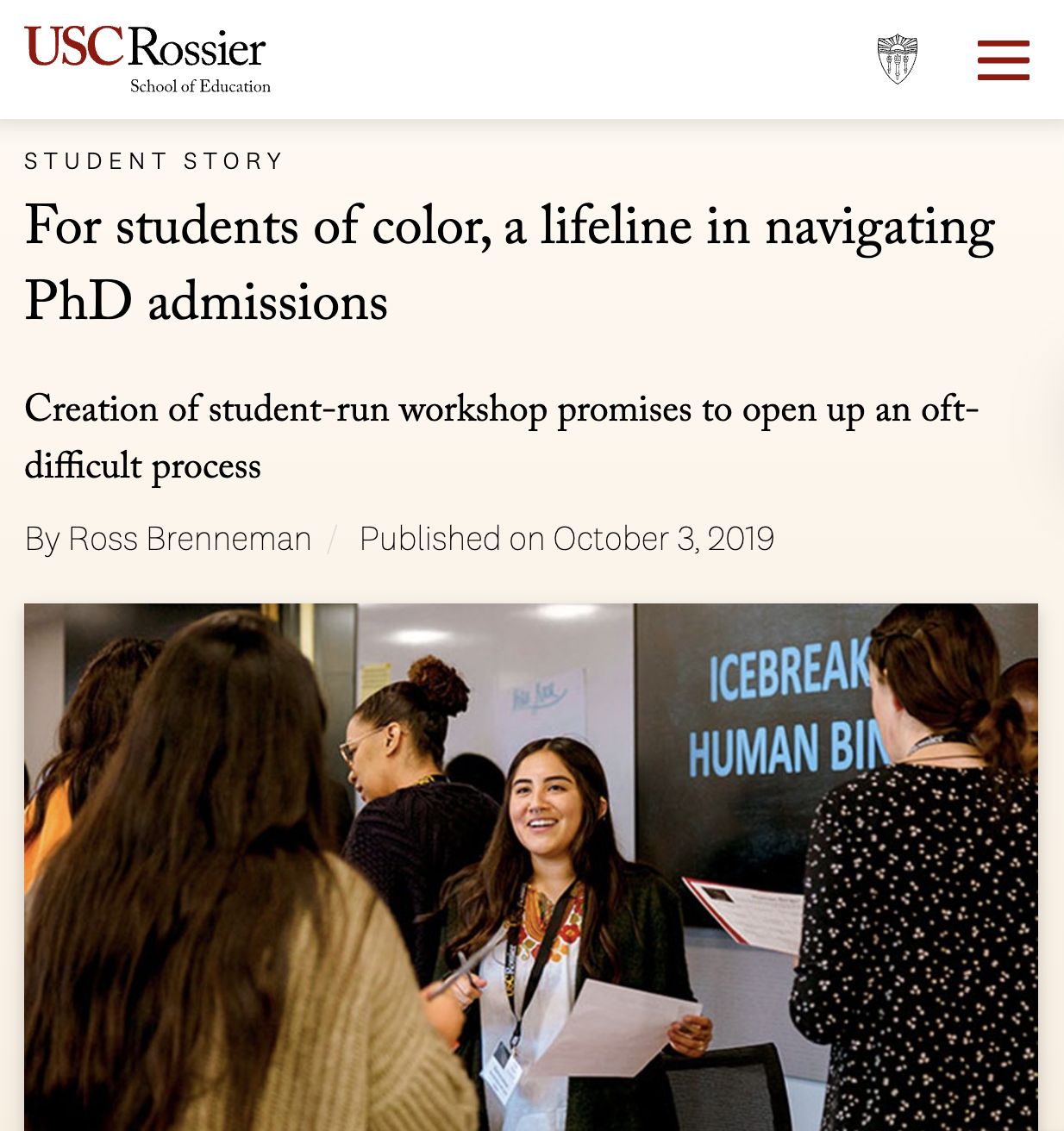 Group of diverse women at an academic event, with one woman smiling and holding papers, standing in front of a blackboard with the words 'ICEBREAK HUMAN BIN' written on it.