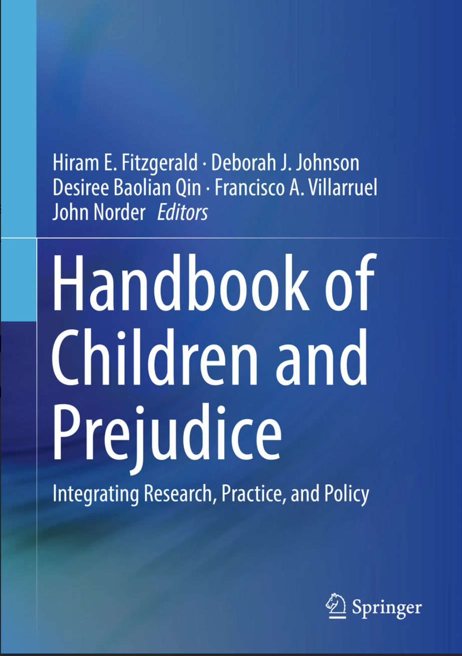Cover of the book titled "Handbook of Children and Prejudice: Integrating Research, Practice, and Policy," published by Springer, with authors Hiram E. Fitzgerald, Deborah J. Johnson, Desiree Baolian Qin, Francisco A. Villarruel, and John Norder.