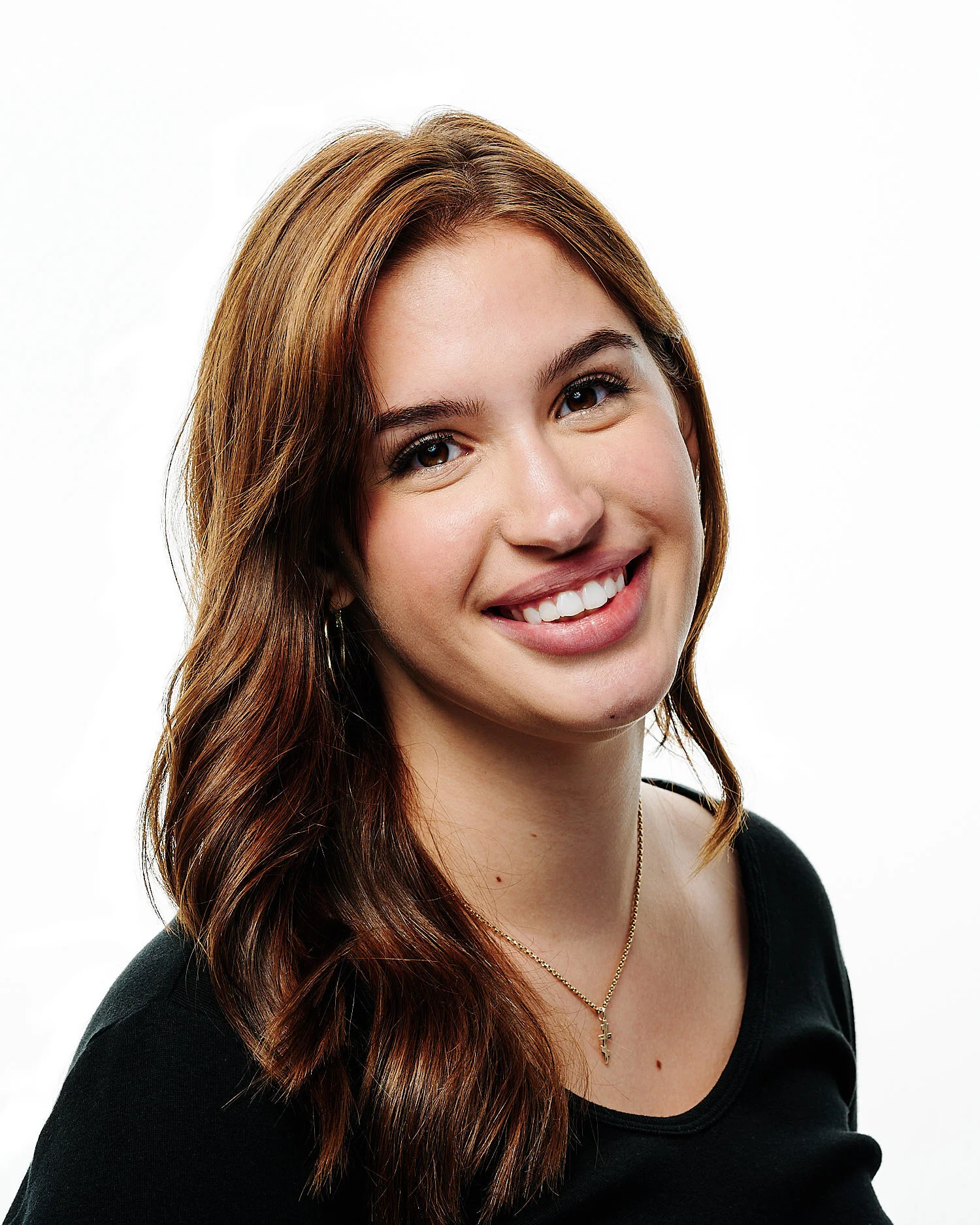  Caroline Sanfilippo is posing for actor headshots against white background in a professional photography studio. She looks gorgeous with her brown eyes and long hair 