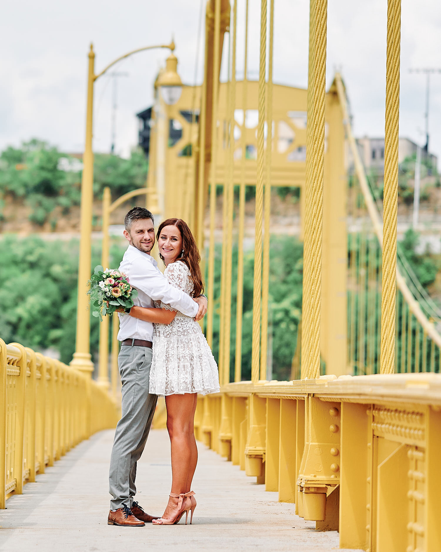  Olga Shuleika and Dzmitry Hryher are tying the knot on a hot summer day in a private ceremony in Pittsburgh city magistrate. The girl looks beautiful in small white lace dress and she is pregnant. 