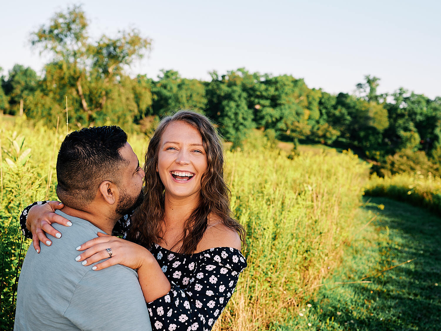  Sarah Trovato and Erick Ortiz are celebrating their engagement to get married on a hot summer day in Fern Hollow Nature Center near Sewickley, Pennsylvania. They look blissfully happy and joyful. 