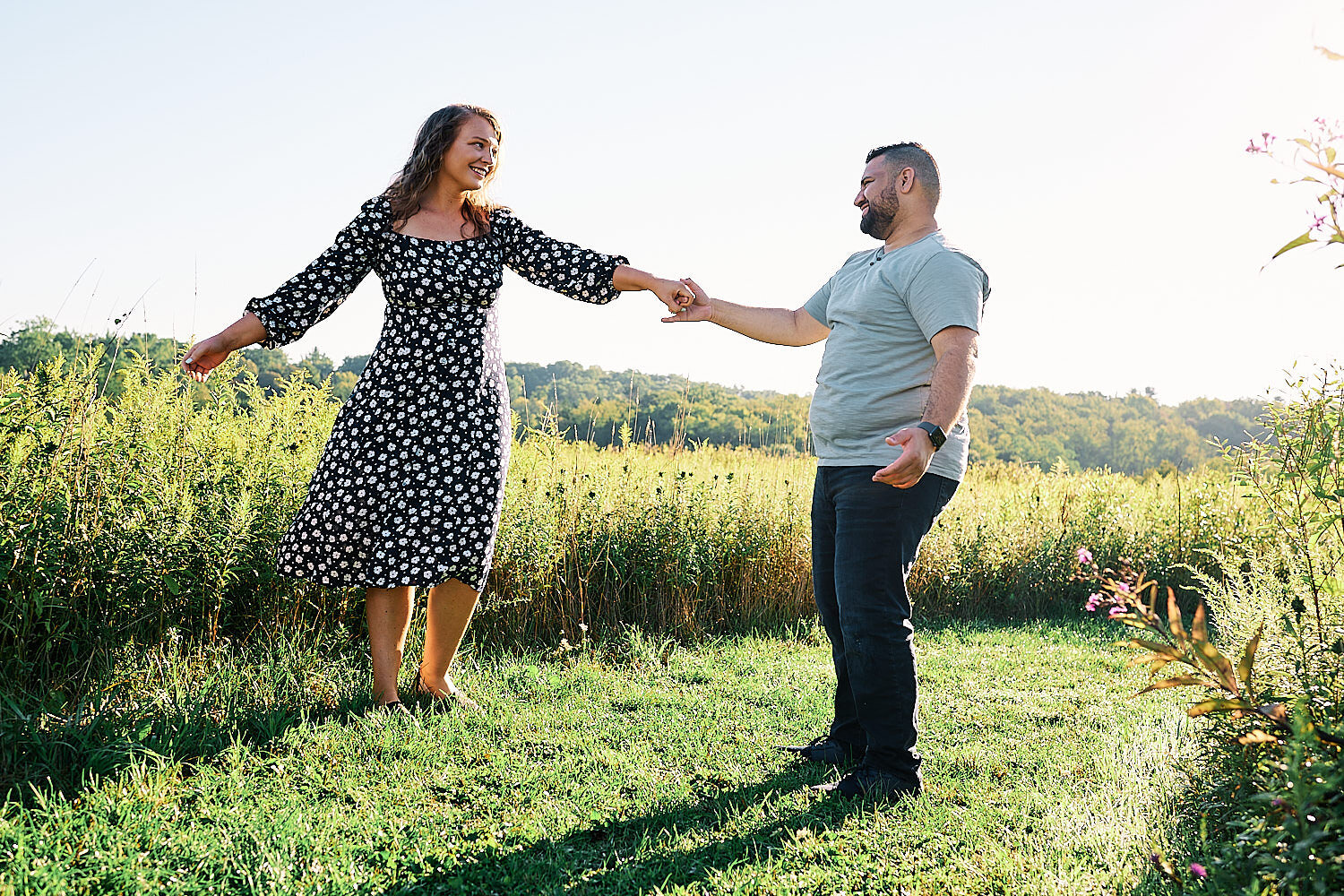  Sarah Trovato and Erick Ortiz are celebrating their engagement to get married on a hot summer day in Fern Hollow Nature Center near Sewickley, Pennsylvania. They look blissfully happy and joyful. 