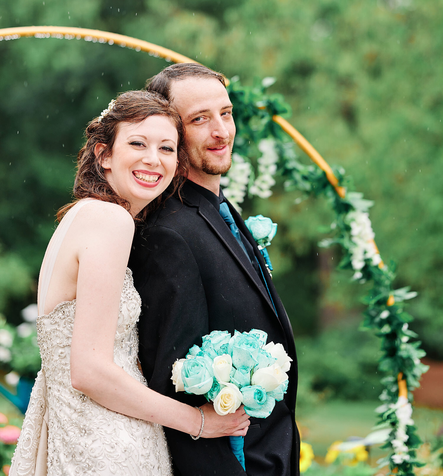  Alyssa Busching and George Goettel are getting married in their grandparents’ backyard under the pouring rain in the minds of the COVID-19 pandemic with only closest friends and family at the ceremony 