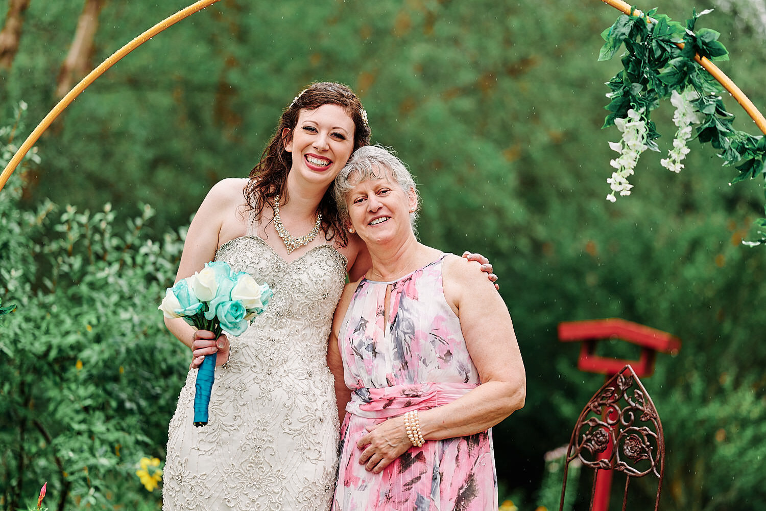  Alyssa Busching and George Goettel are getting married in their grandparents’ backyard under the pouring rain in the minds of the COVID-19 pandemic with only closest friends and family at the ceremony 