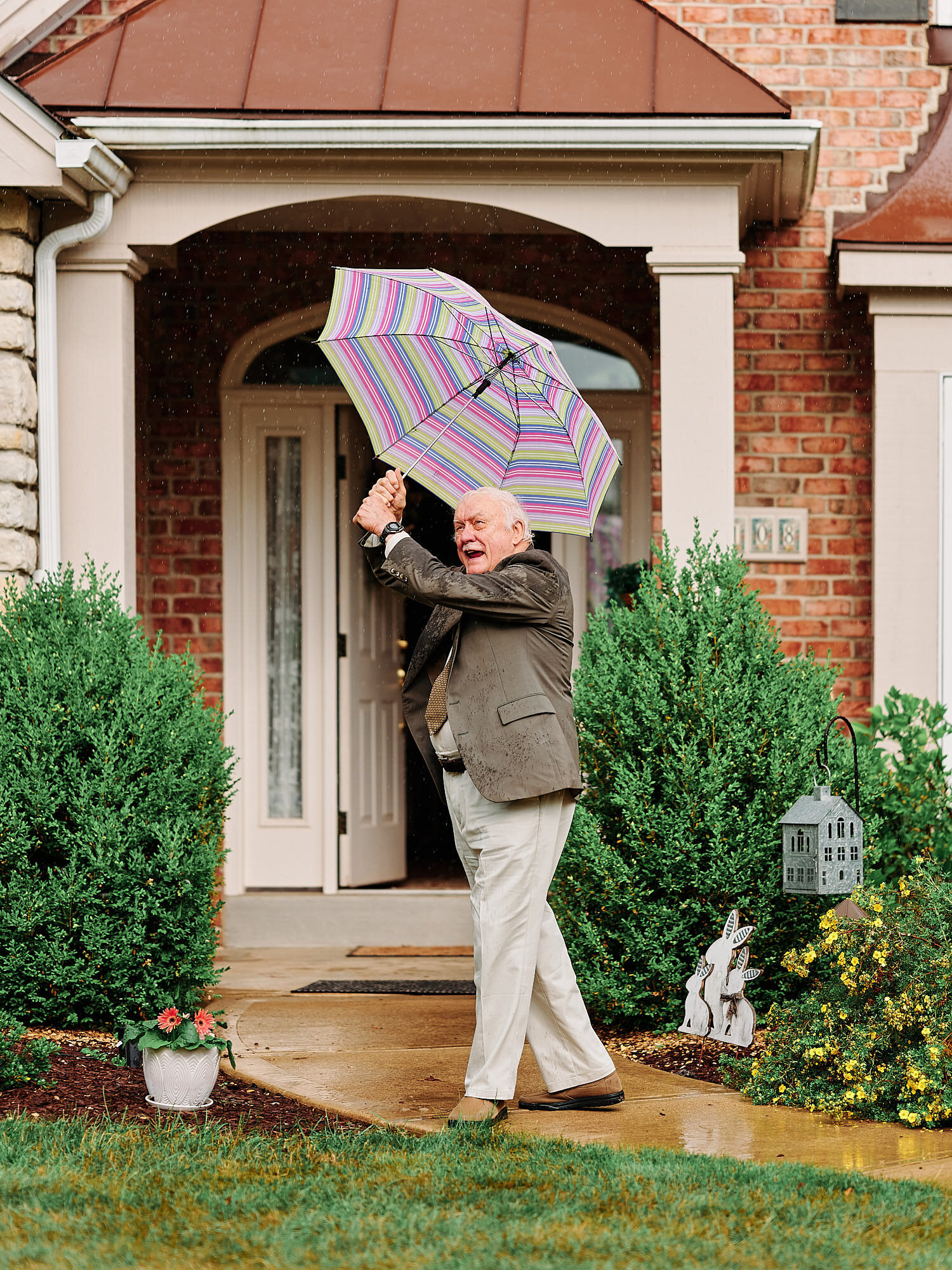  Alyssa Busching and George Goettel are getting married in their grandparents’ backyard under the pouring rain in the minds of the COVID-19 pandemic with only closest friends and family at the ceremony 